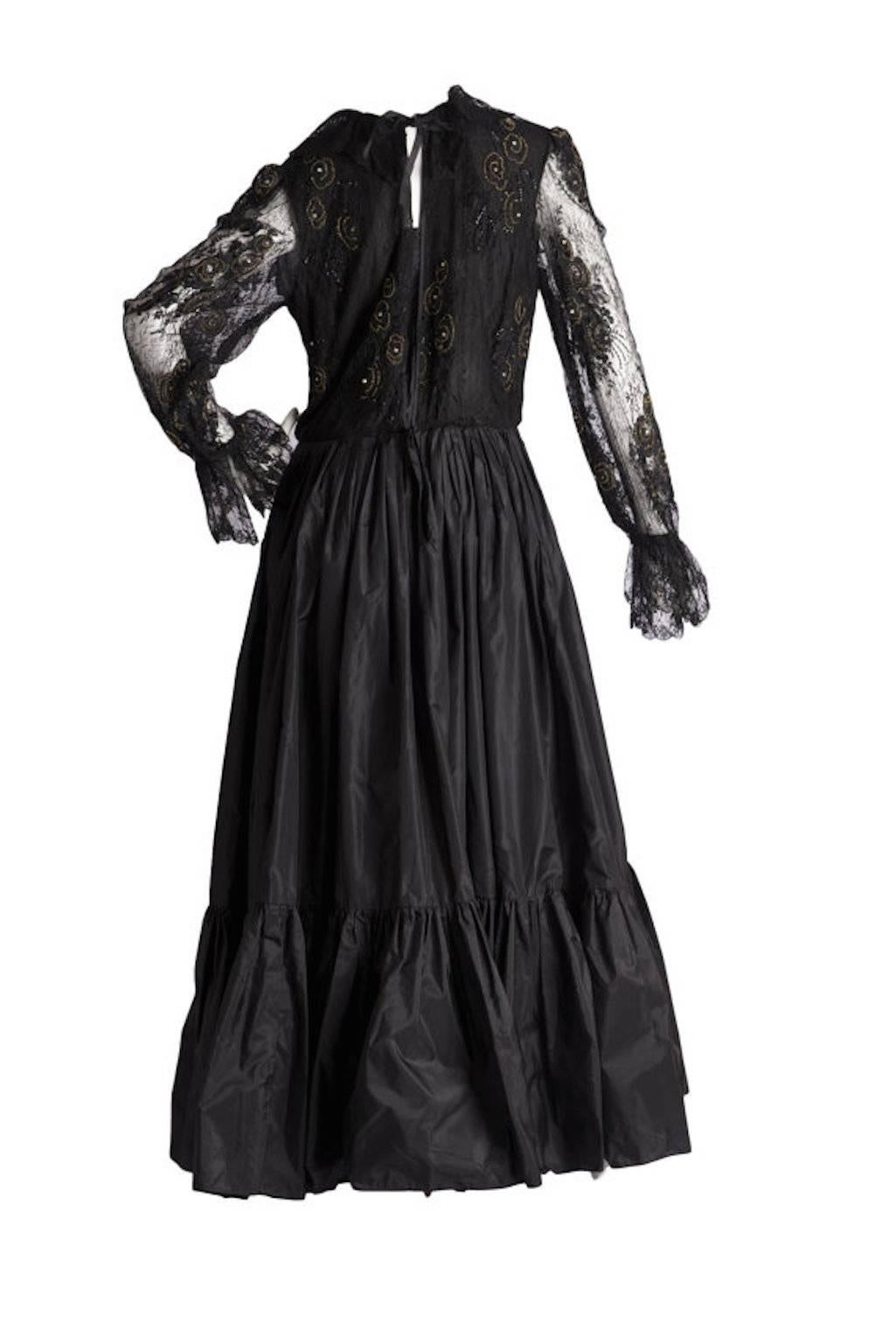 Paul-Louis Orrier Couture Vintage Dress. With lace long sleeve top with sequins and beads lined with silk, has back hook/eye entry to the bodice, skirt is constructed of a silk layer and taffeta over skirt. Skirt has zip and hook/eye entry.

Size