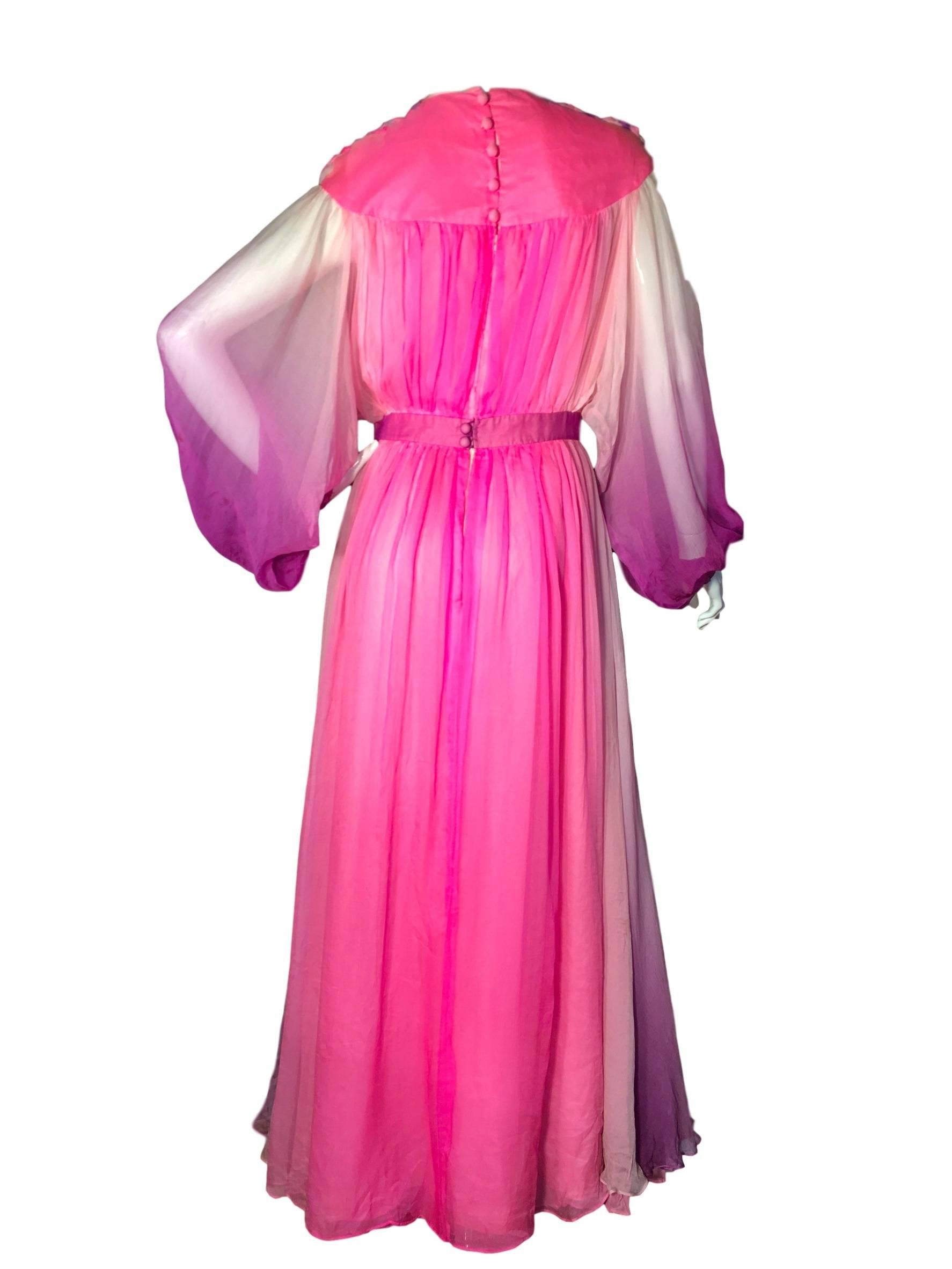 Norman Hartnell silk chiffon grecian maxi dress from the 1970s Ready To Wear range. This dress is made from silk chiffon with rayon lining, it is pink and purple with purposely colour fading/transitioning effect to it. The shoulders have plaited