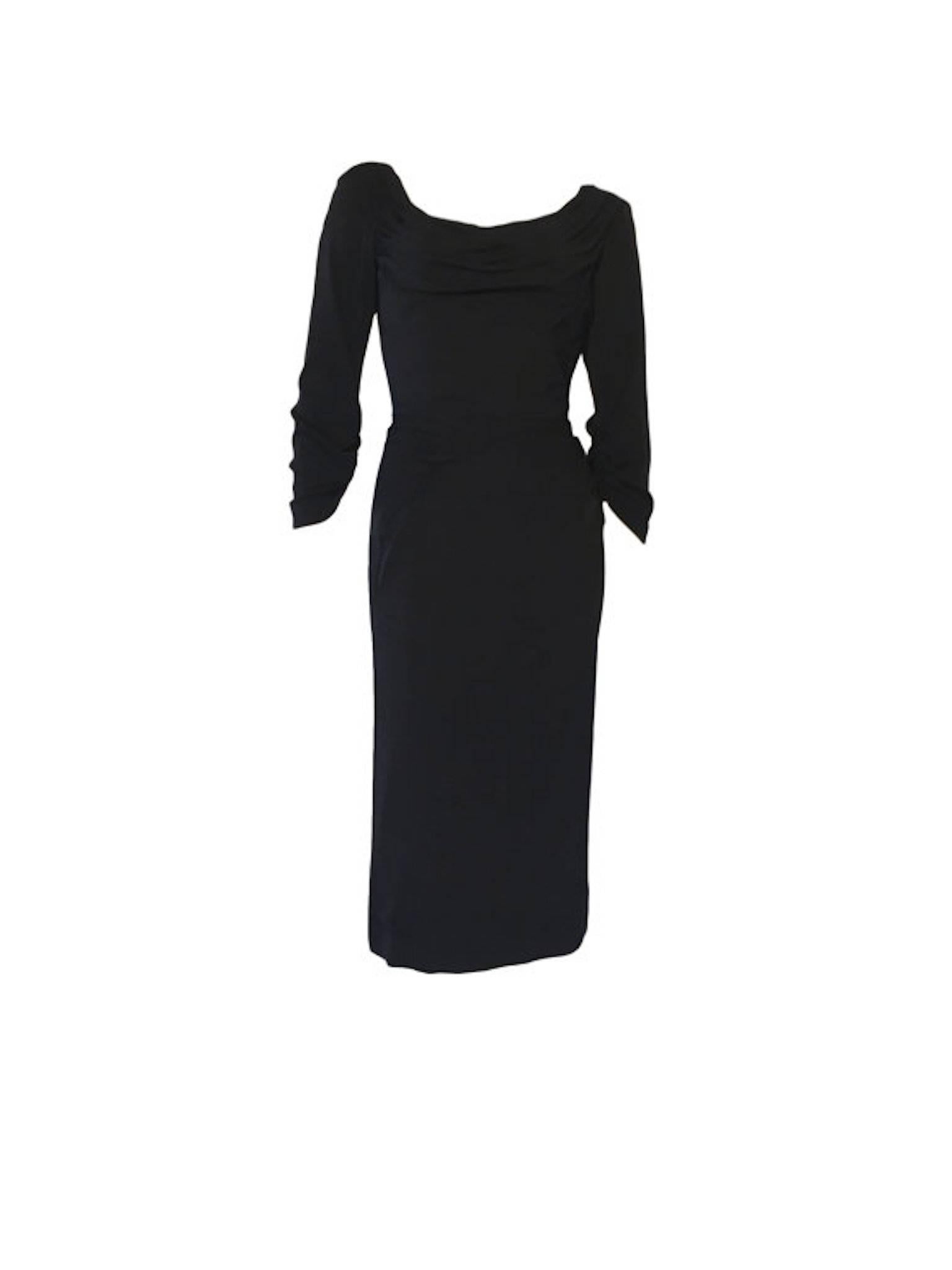 Ceil Chapman vintage 1950s black draped/gathered wiggle dress. In a silk jersey material with metal zip fastening.

Size UK 8 measures 16.5 inches across bust, 12.5 inches across waist and 45 inches length. 
