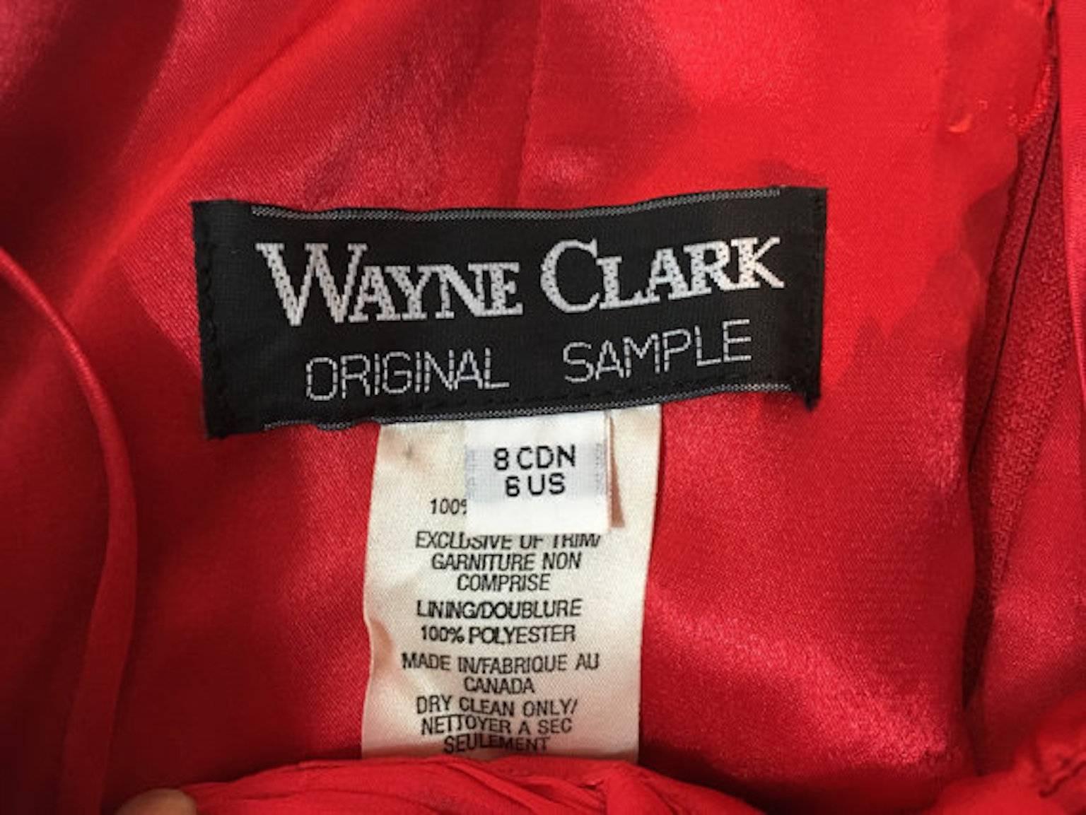 Wayne Clark red halter neck chiffon silk cocktail dress, with long chiffon shawl. Labelled a sample. Has back zip fastening.

Size UK 8, 16 inches across bust and 35 inches length inches length 

Excellent condition