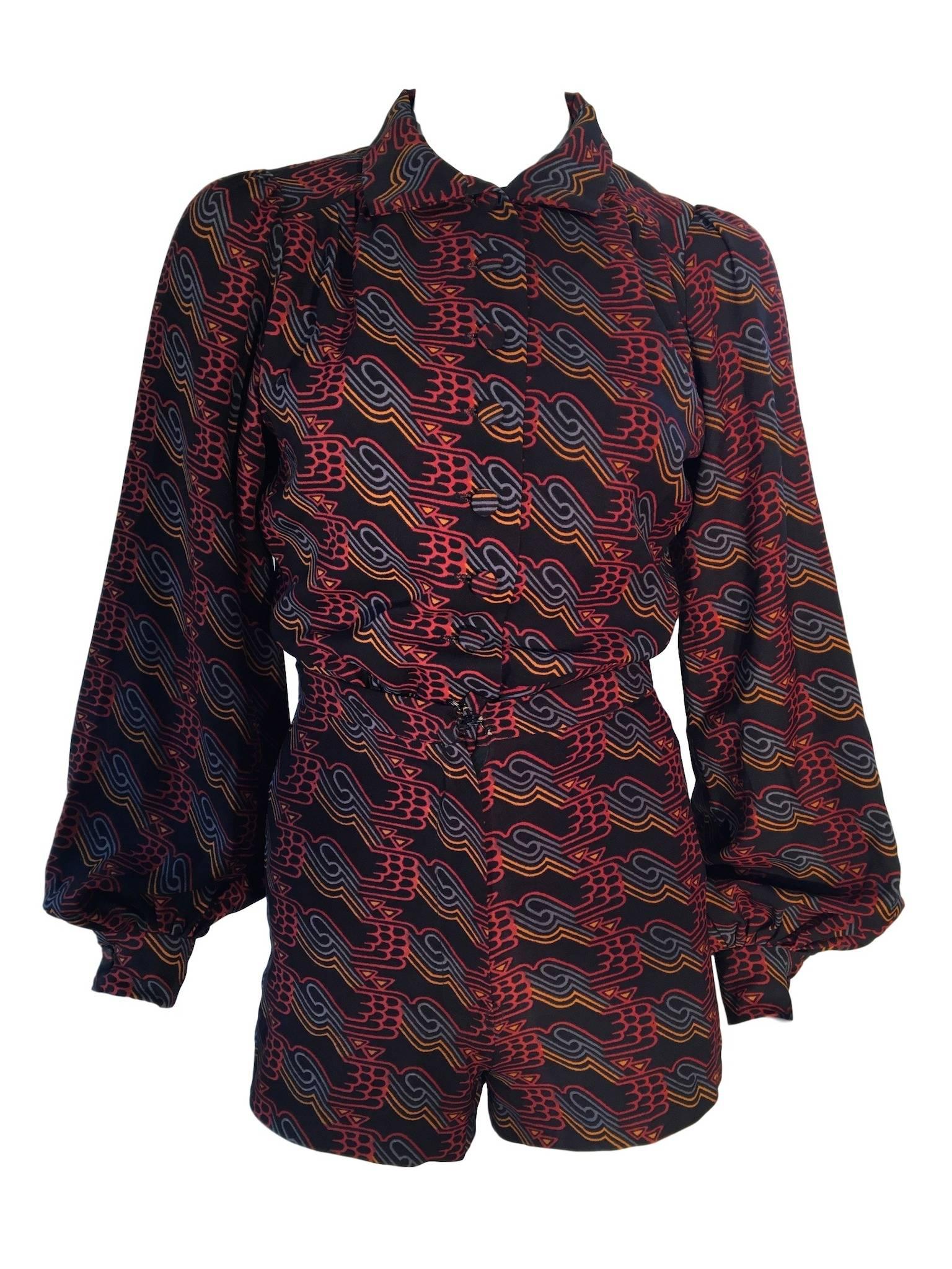 Vintage 1970s Lee Bender at Bus Stop moss crepe material with deco print top and hot pants set. Button front blouse with poet sleeves, high waisted hot pants that fasten at the front with a zip. 

Size UK 8 Measuring 18 inches across chest and 23