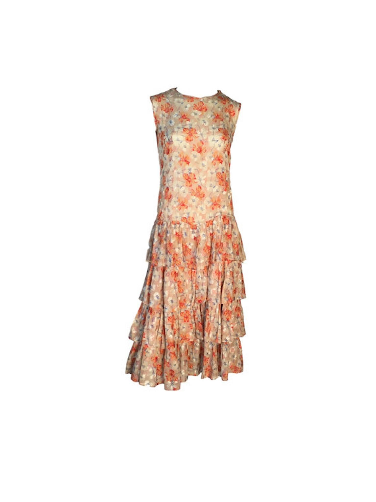 So pretty and feminine 1930s fine cotton floral printed and embroidered dress. With tiered dropped waist, has relaxed fit and shoulder popper entry.

Size UK 8. Measuring 16 inches across bust and 48 inches length

In excellent wearable