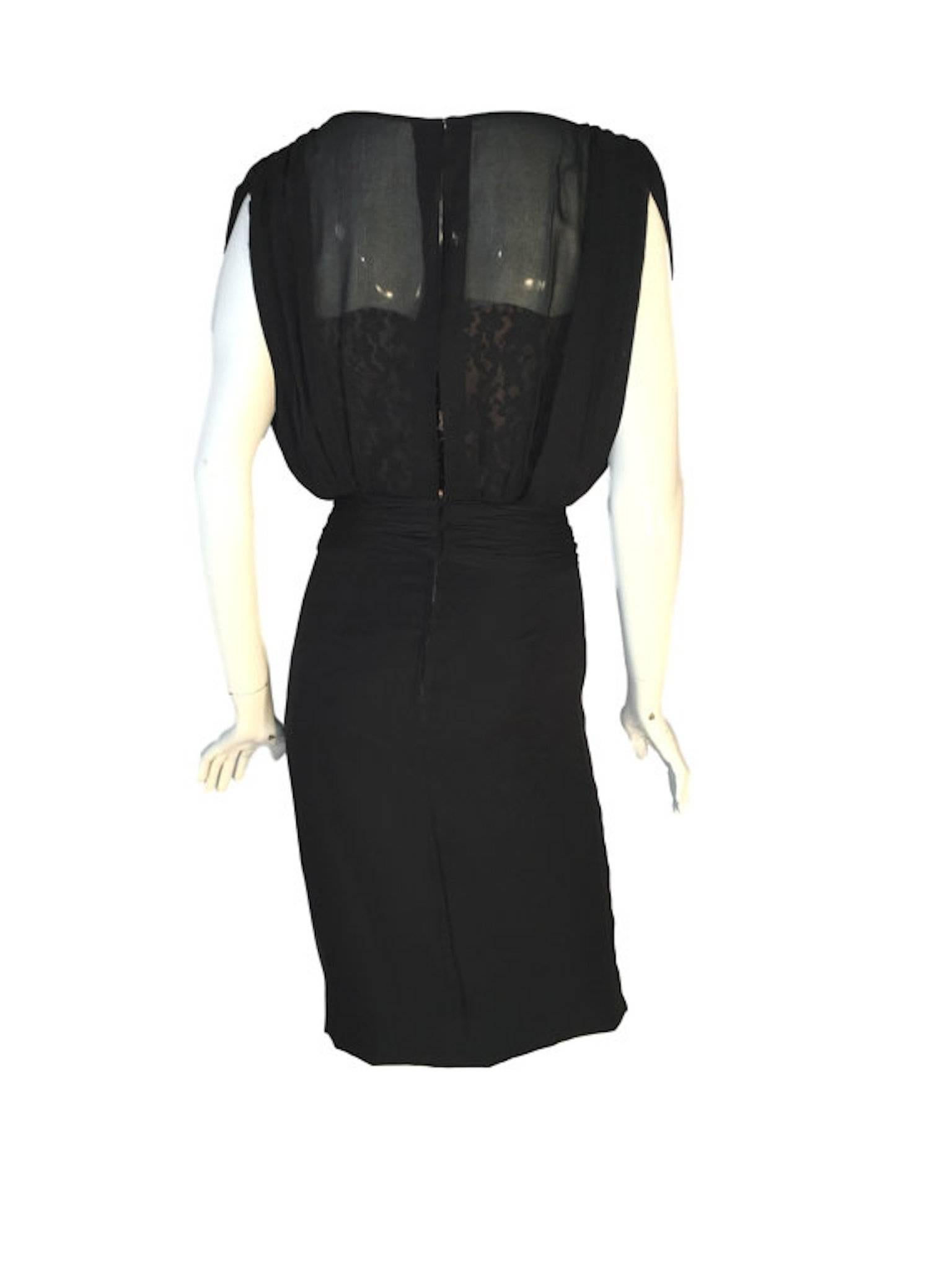 
Early 1960s Hardy Amies black silk cocktail dress. With boned inner lace covered nude bodice, a chiffon silk loose fitting top overlay. Metal back zip fastening and hook/eye waist and back neck detail.

Size UK 8 Measures: 17 inches across bust, 13