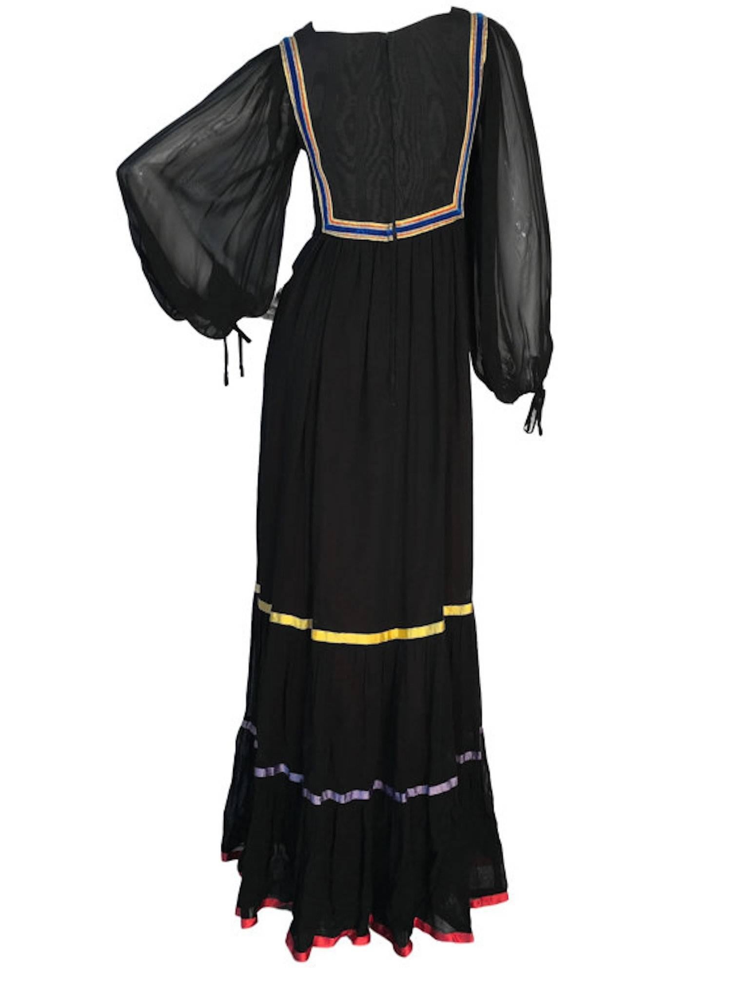 Rumak & Sample black maxi peasant style dress, with bishop sleeves, embroidered bodice, ribbon satin and velvet trims.

Size UK 8/10  Measuring 17 inches across bust, 14.5 inches across waist and 59 inches length. 

Very good condition, some damage