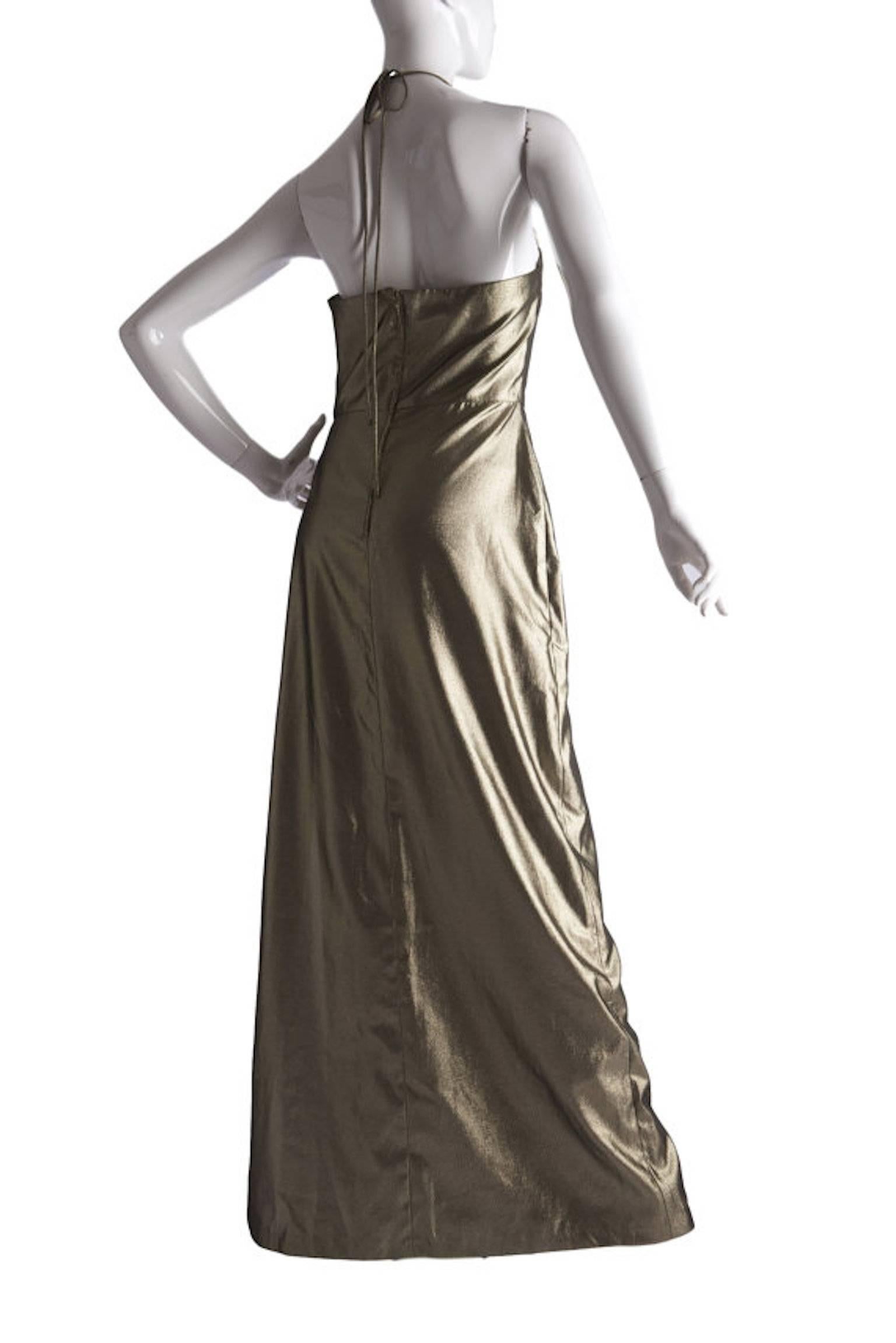 Biba vintage 1970s gold metallic halter neck evening maxi dress.

Size UK 10 Measuring 18 inches across bust 14 inches across waist and 58 inches length.

Excellent condition

Postage is complimentary within the UK for is item.
