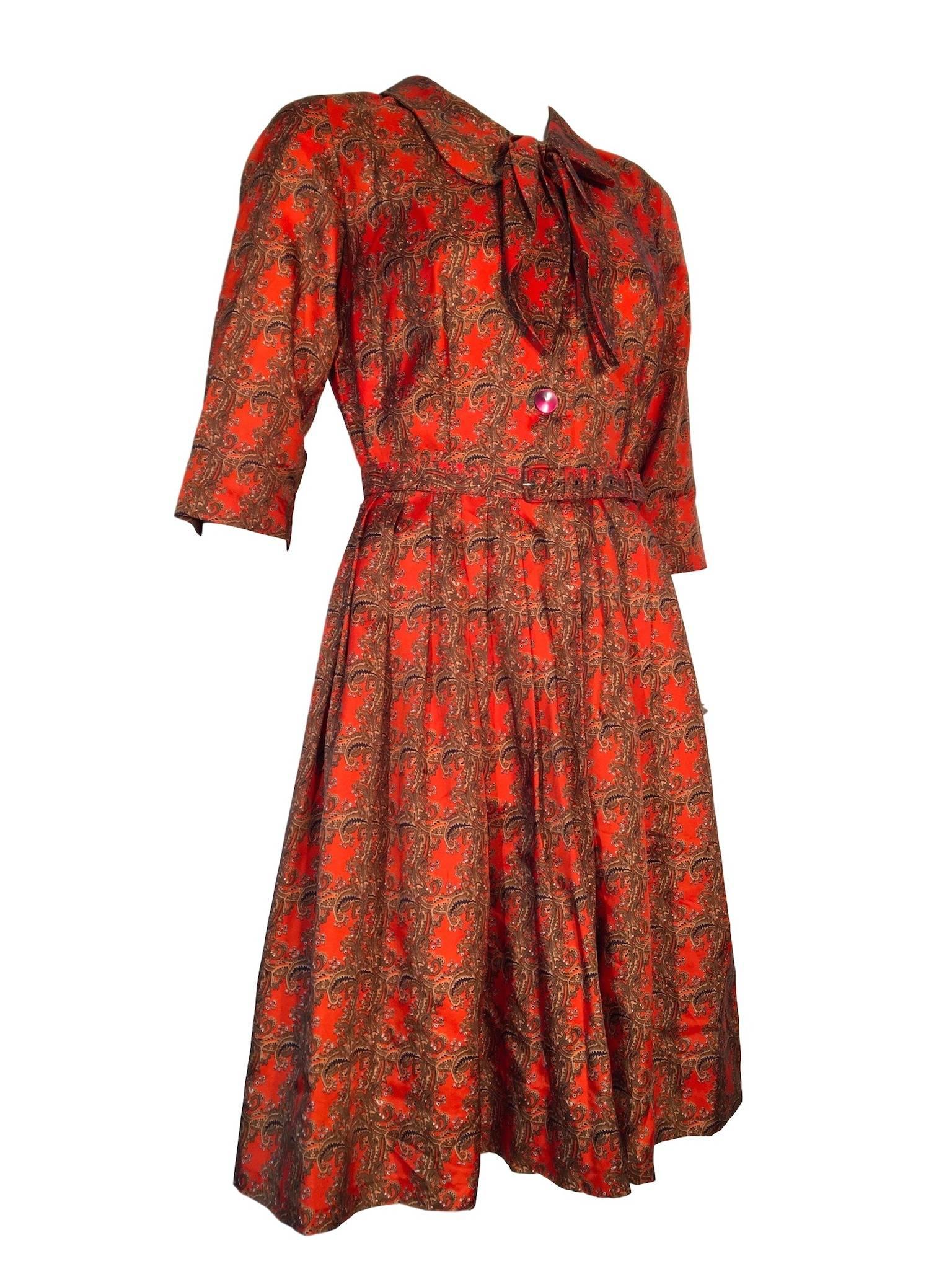 Julius Tricel material paisley orange fit & flare dress, has button front and matching belt.

In excellent condition 

Size UK 10, Measures 18 inches across bust, 14 inches across waist and 40 inches total length, all taken with garment laid flat
