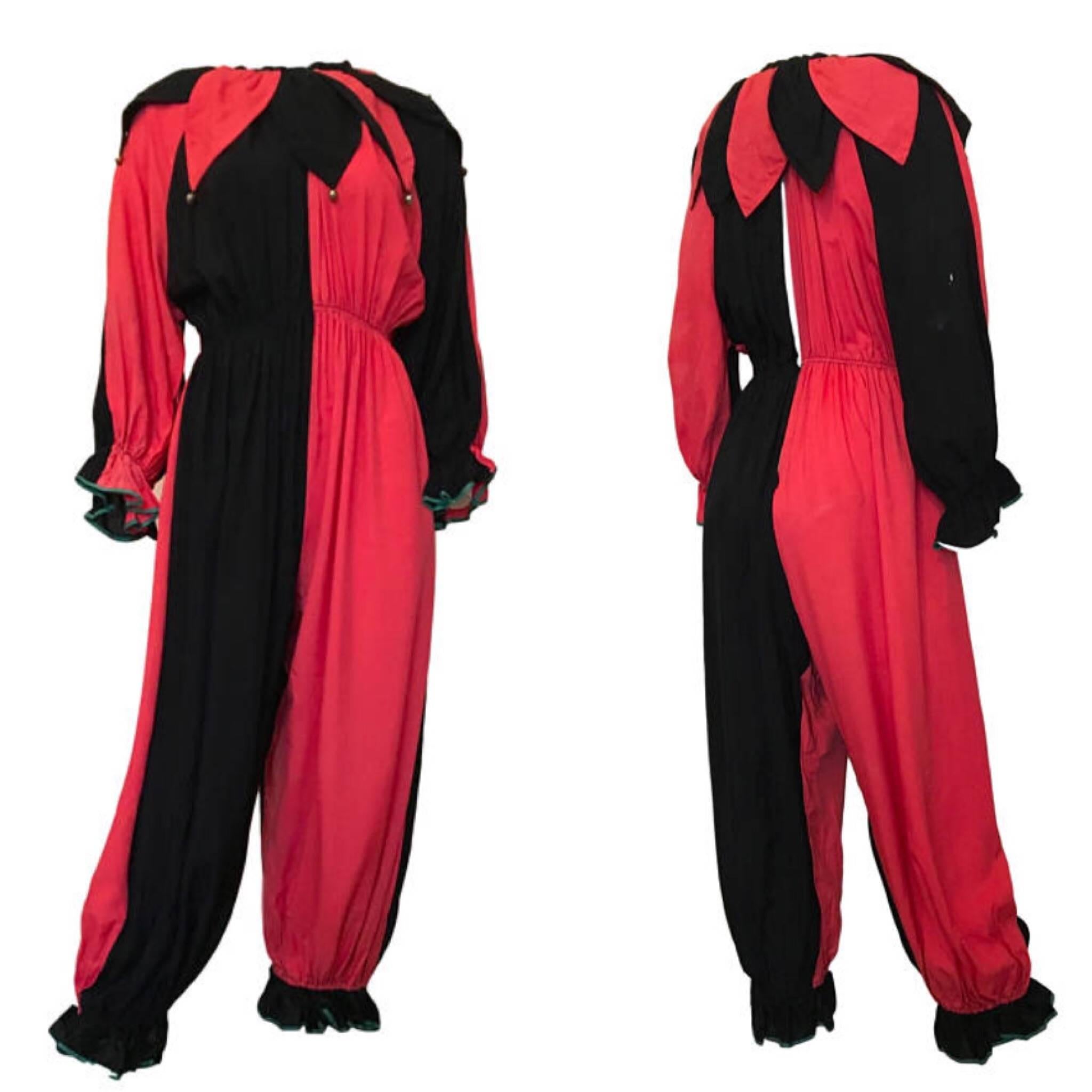 1920s vintage original harlequin costume/ Jumpsuit. With ballooned leg, gathered ankles and wrists with a green piping, open back feature, hook/eye fastening and separate neck piece with bells! Made from a silky rayon material.

Size UK 8/10.