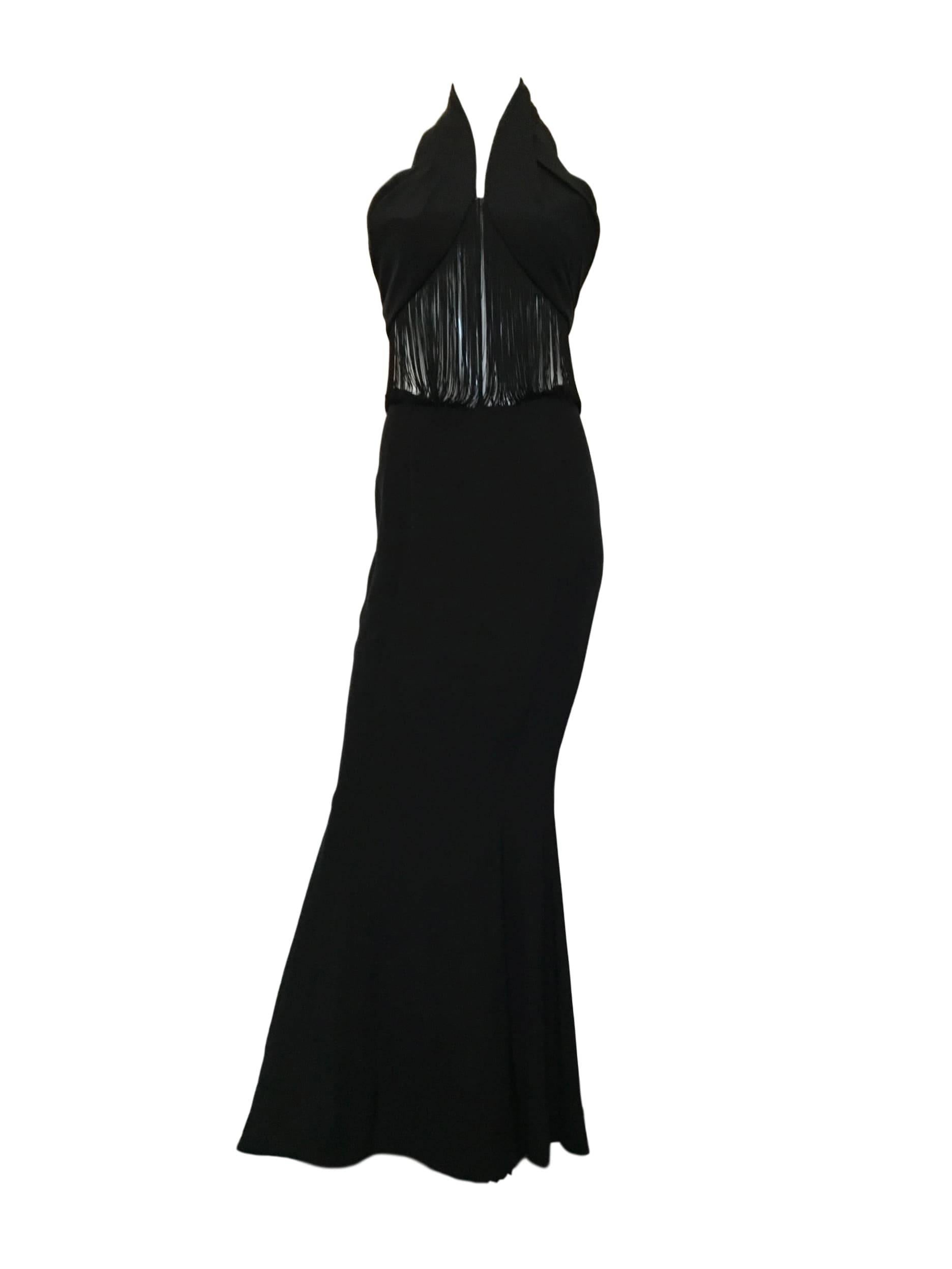 Vintage Black Greg Snyder 1980s era super long fishtail evening dress. With tasselled open mid section. Made from a jersey rayon material.

Size UK 8/10. Measuring 17 inches across bust 14 inches across waist and 64 inches length

In excellent