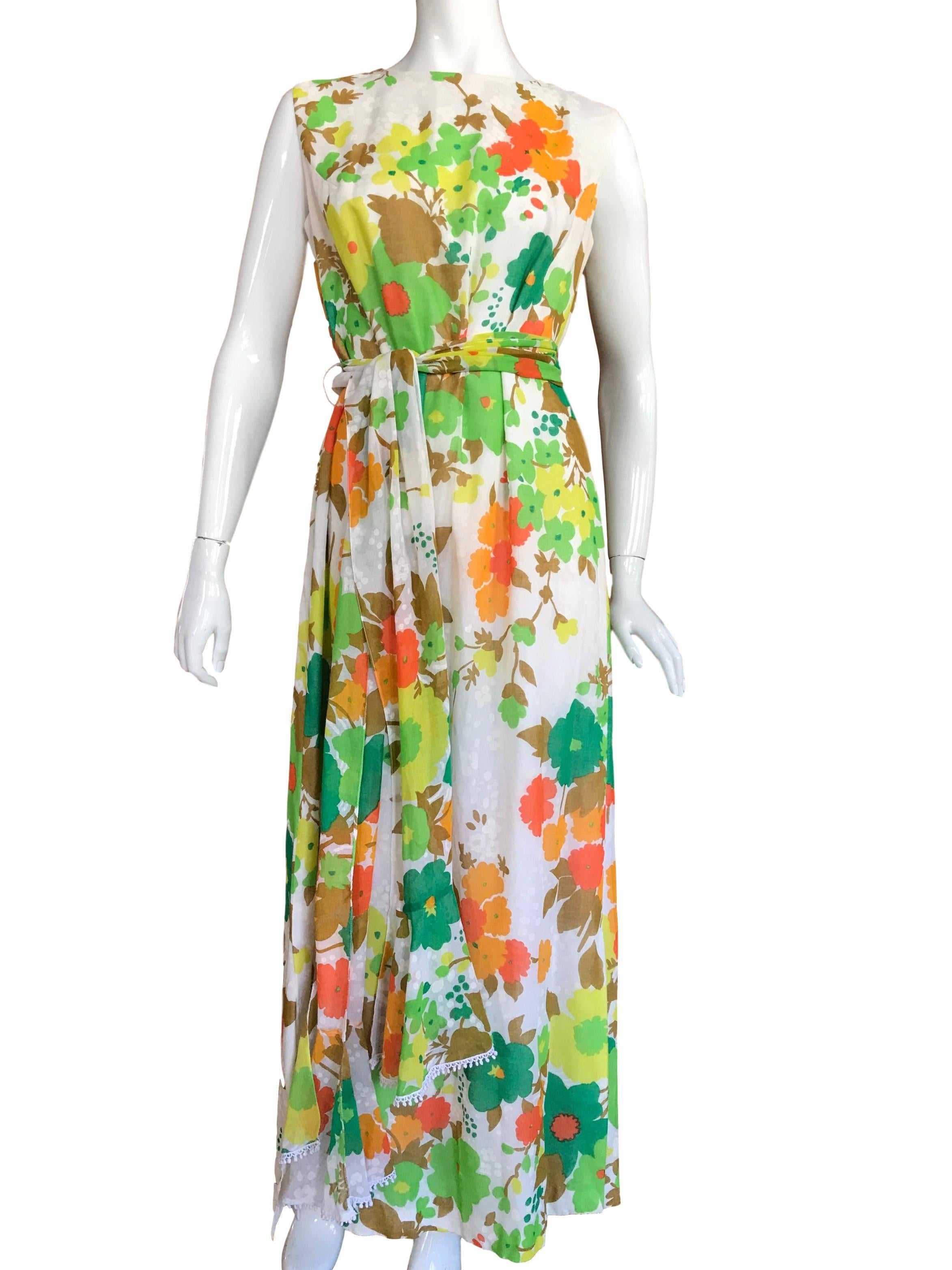 Crestina original late 60s early 70s Terryline and cotton blend 50/50 floral cotton maxi dress. With long sash/belt and back zip fastening.

Excellent condition.

Fits a UK size 12/14 Measuring 20 inches across bust and 58 inches length.