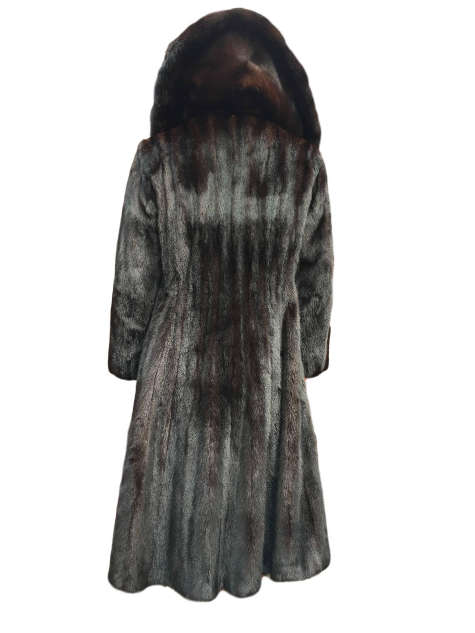 Vintage 1970s Blackglama at Hudsons Bay dark mink coat. Made from the darkest natural mink pelts. Has original belt, fox fur collar at inner and mink on outer. Silk satin lined, has original owners name stitched into it. 

Size Uk 8. Measures 18