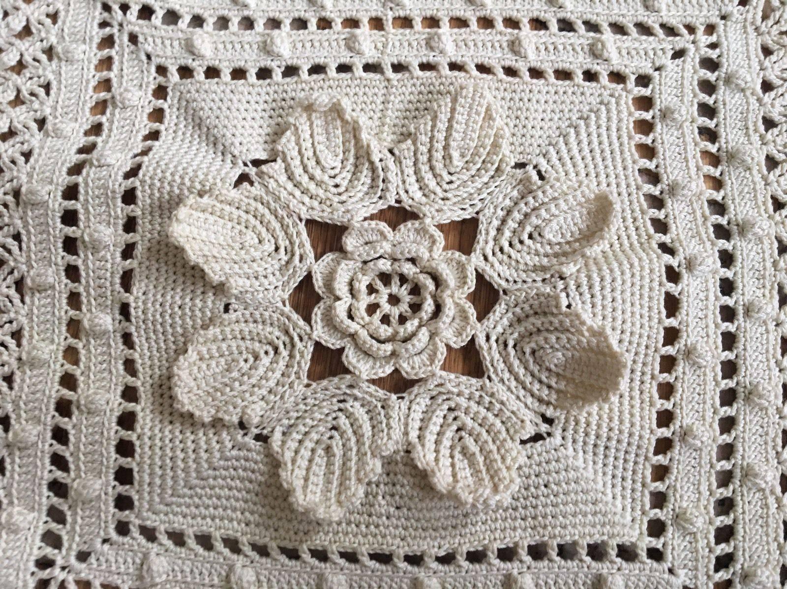 Antique Edwardian era hand crocheted bedspread each square has a raised flower they have been tucked in and I'm slowly pulling them all out, and each square measures 20 cm.

Excellent condition

The whole thing measures 2.85 x 2.56 metres and weighs