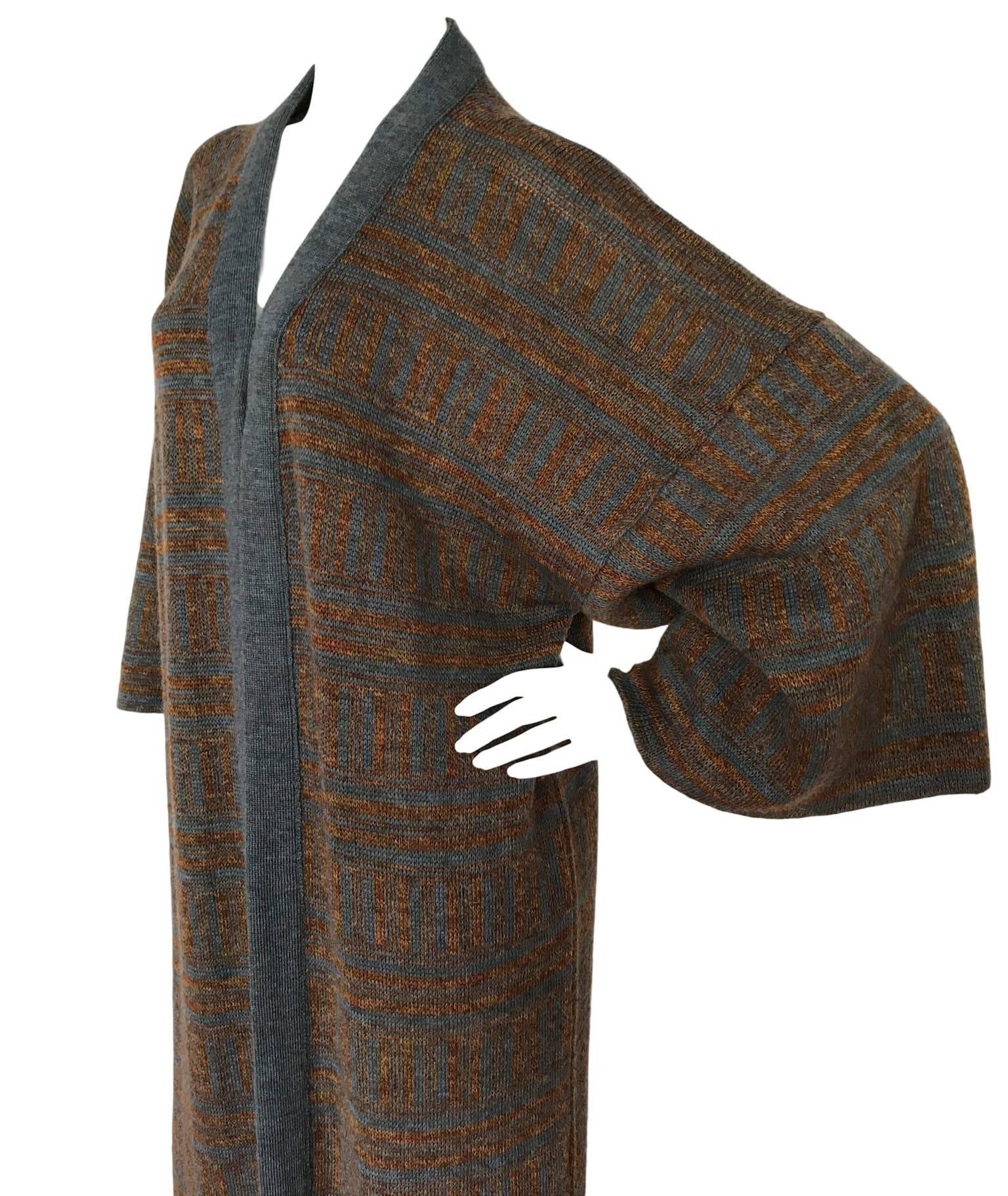 Bill Gibb 1970s knitted coat, made from pure wool and has wide kimono like sleeves. In excellent condition. Free sized up to a UK 12/14 and 42 inches length.