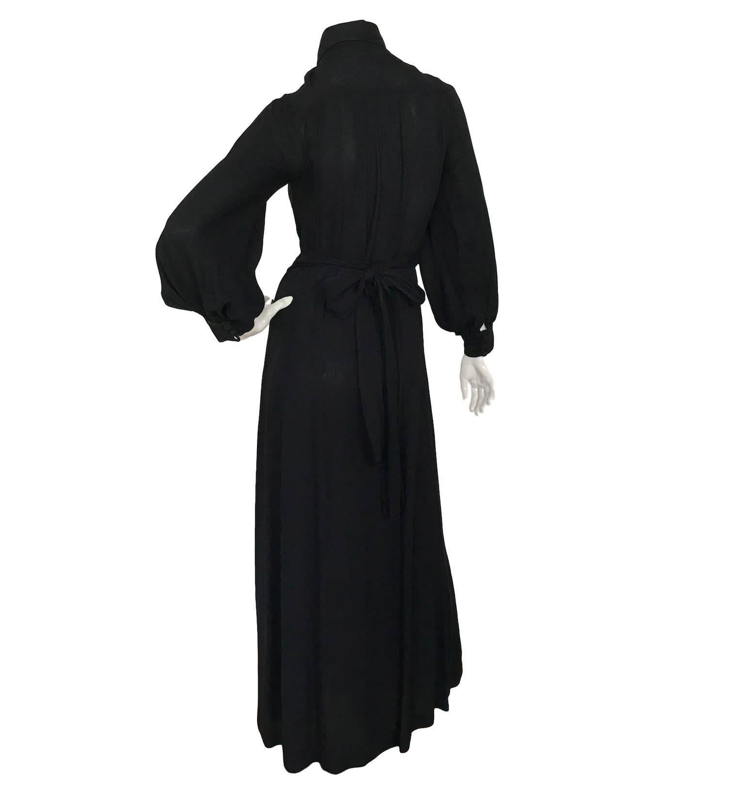 Ossie Clark for Radley black moss crepe dress. With button front fastening, penny collar and poet sleeves. Measures 32 inch bust and 58 inches length 
In very good condition, with a button missing.