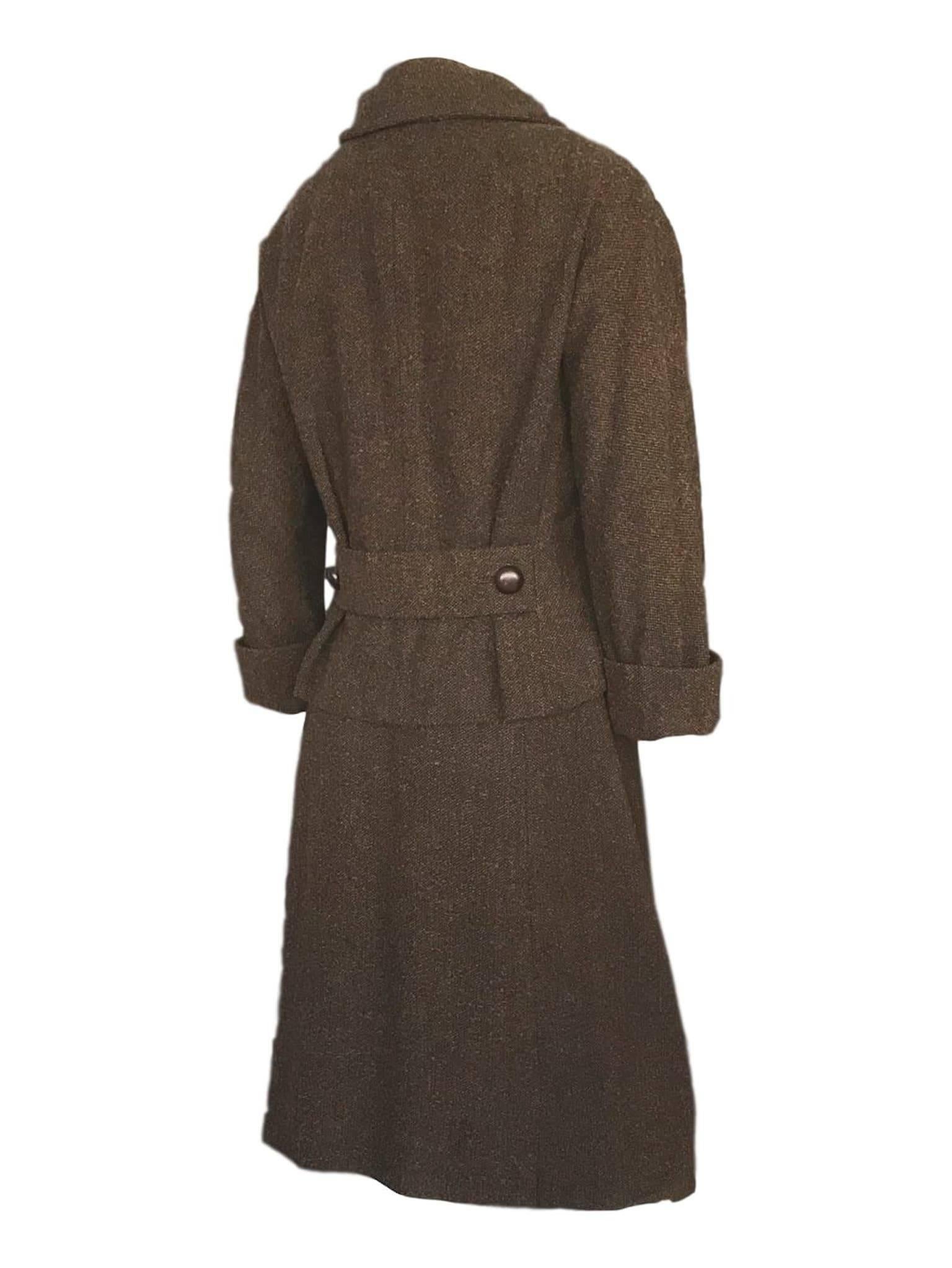 Christian Dior New York early 1950s wool 2 piece. Textured brown boucle wool with fleck, silk damask logo printed lining. 
36 bust and 24 inch jacket length, 25 inch waist, 20 hips, skirt is 25.6 length with 5 inch selvedge 
Excellent condition