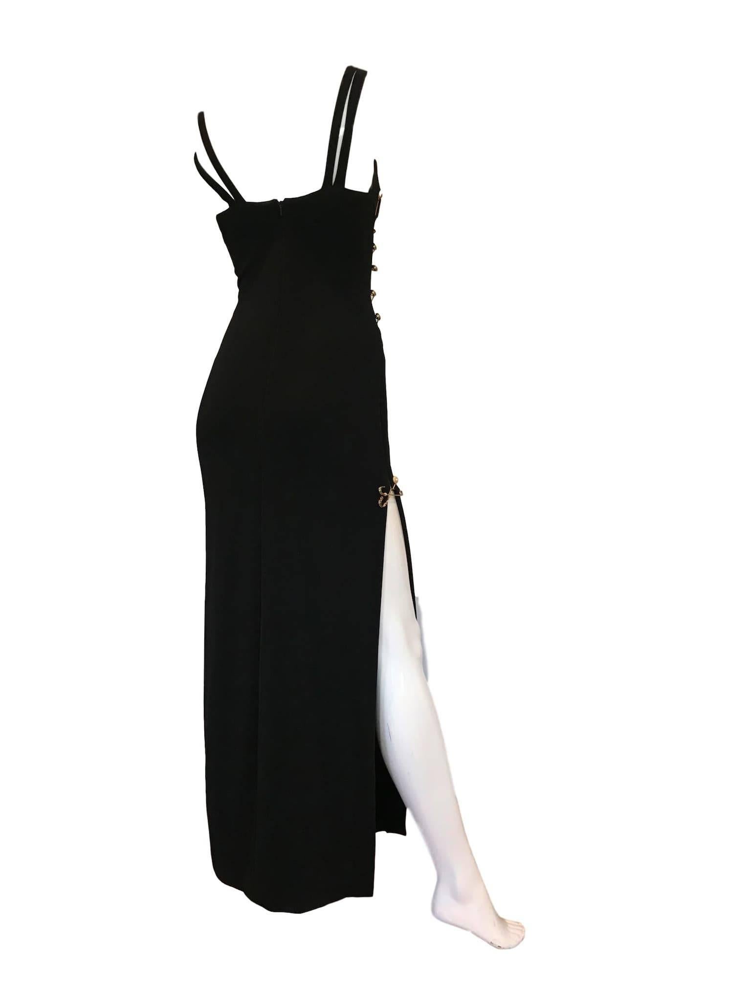 Bernshaw 1994 copy of the Iconic Liz Hurley Versace Dress, these examples were made within days of the famous moment with Hugh Grant on the Red Carpet.
With large gold safety pin feature, plunge bust and high leg. Made from a black ribbed jersey