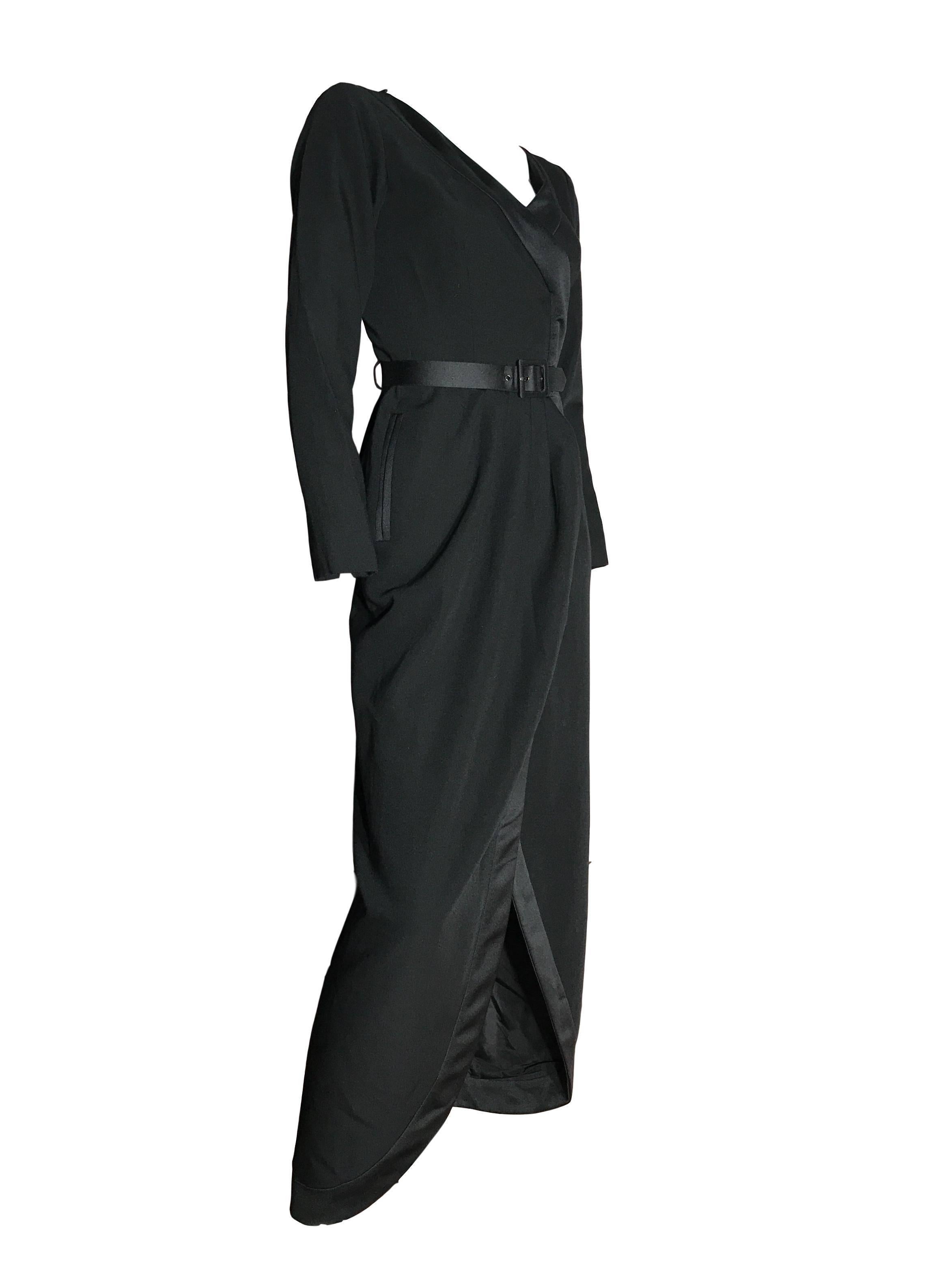 YSL Rive Gauche 100% wool black Tux Dress, with satin trim and belt. Maxi length with tulip front feature on the skirt. 

In excellent condition 

Labelled a 36. Measures 32 bust, 24 waist and 58 inches length.