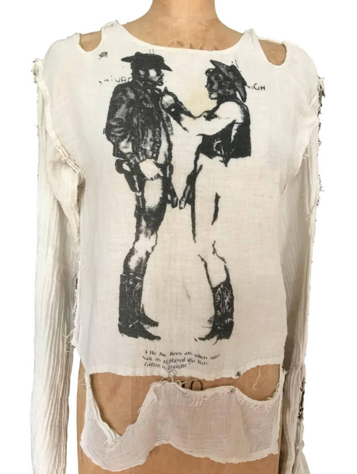 Westwood/ Mclaren Seditionaries "Gay Cowboys" Muslin Shirt / Top Original label but text has faded. 

Up to a 38 chest 

Safety pins holding bottom section onto main body of shirt. In excellent condition compared to many found available