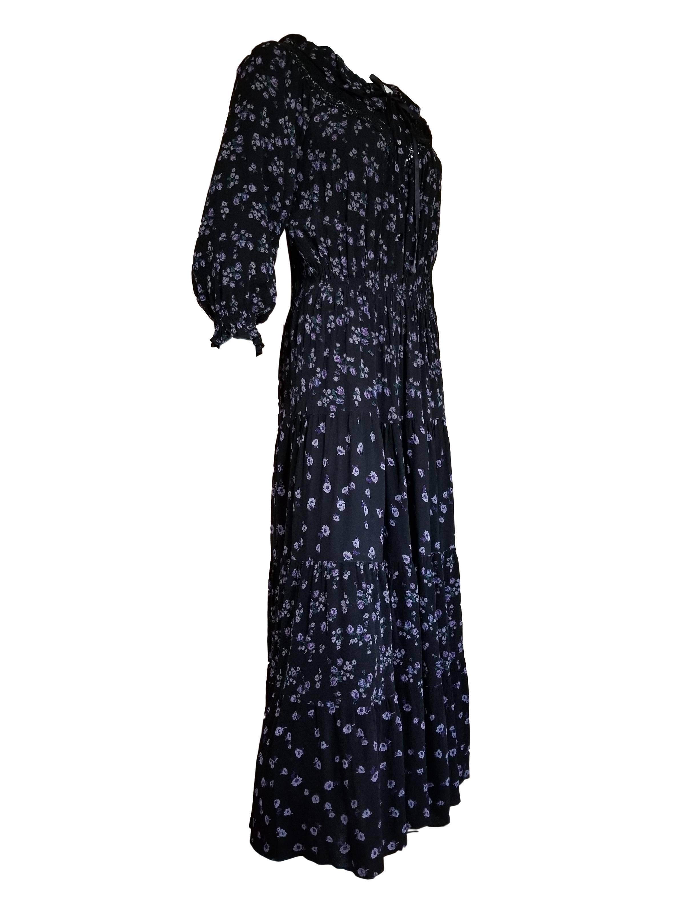 Mushroom by Perlei black crepe with purple floral design gypsy Bohemian Dress. 
Has button front, elasticated waist, tie fastening at neck and tiered full sweep skirt. 

Excellent condition 

UK 10 

Measures 18 inches across chest 11- 14 inches