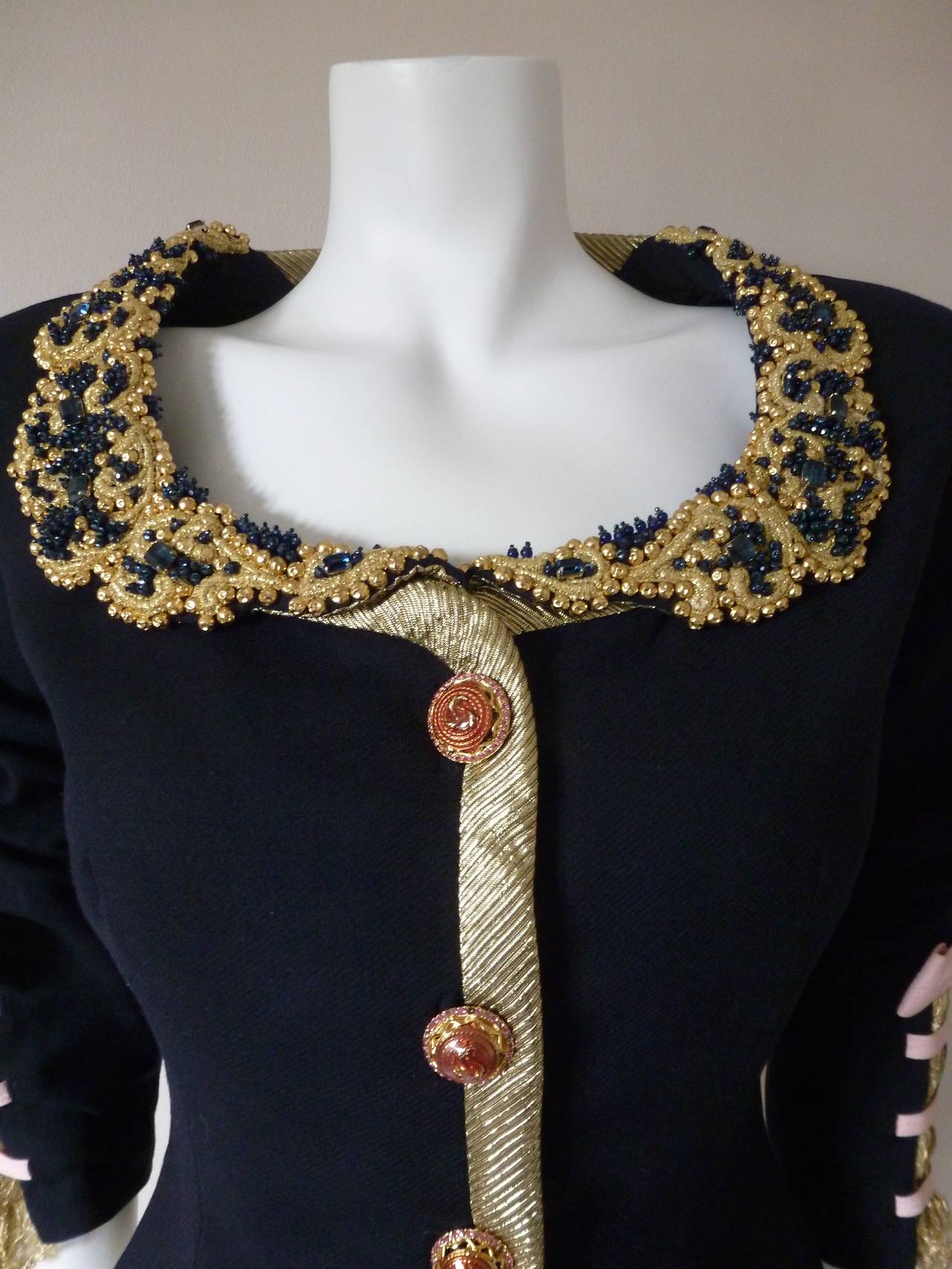 Important Gianni Versace Couture navy wool and silk embroidered and beaded evening jacket with contrast silk bow detailing from the Spring 1992 collection. 

Marked an Italian 40.

Manufacturer - Alias S.p.a.