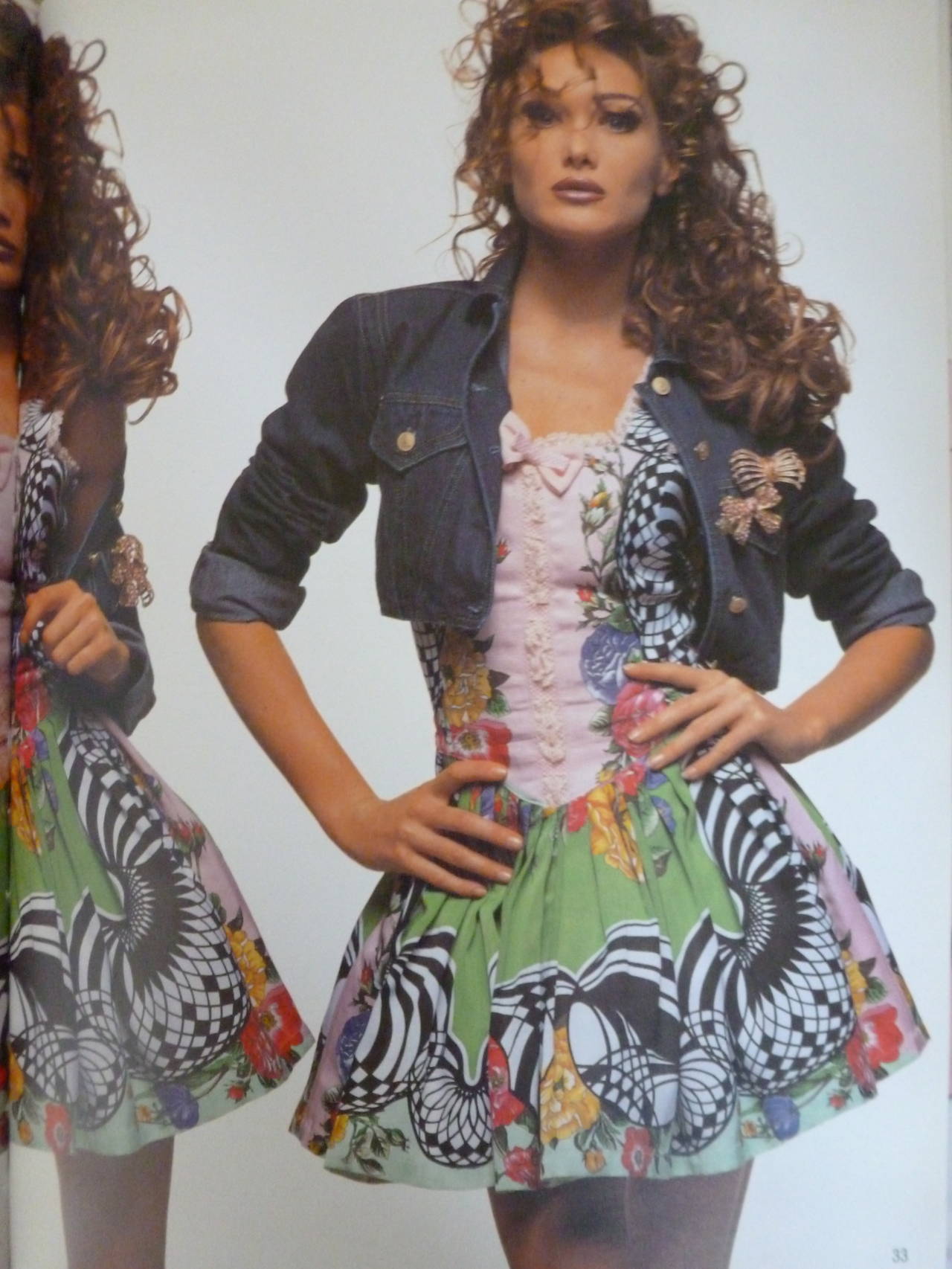 A very rare Gianni Versace Versus printed cocktail dress from the Spring 1992 Versus collection. The dress featured in the advertising campaign for the collection, as modelled by Carla Bruni.

Marked an Italian 44.

Manufacturer - Ittierre S.p.a.