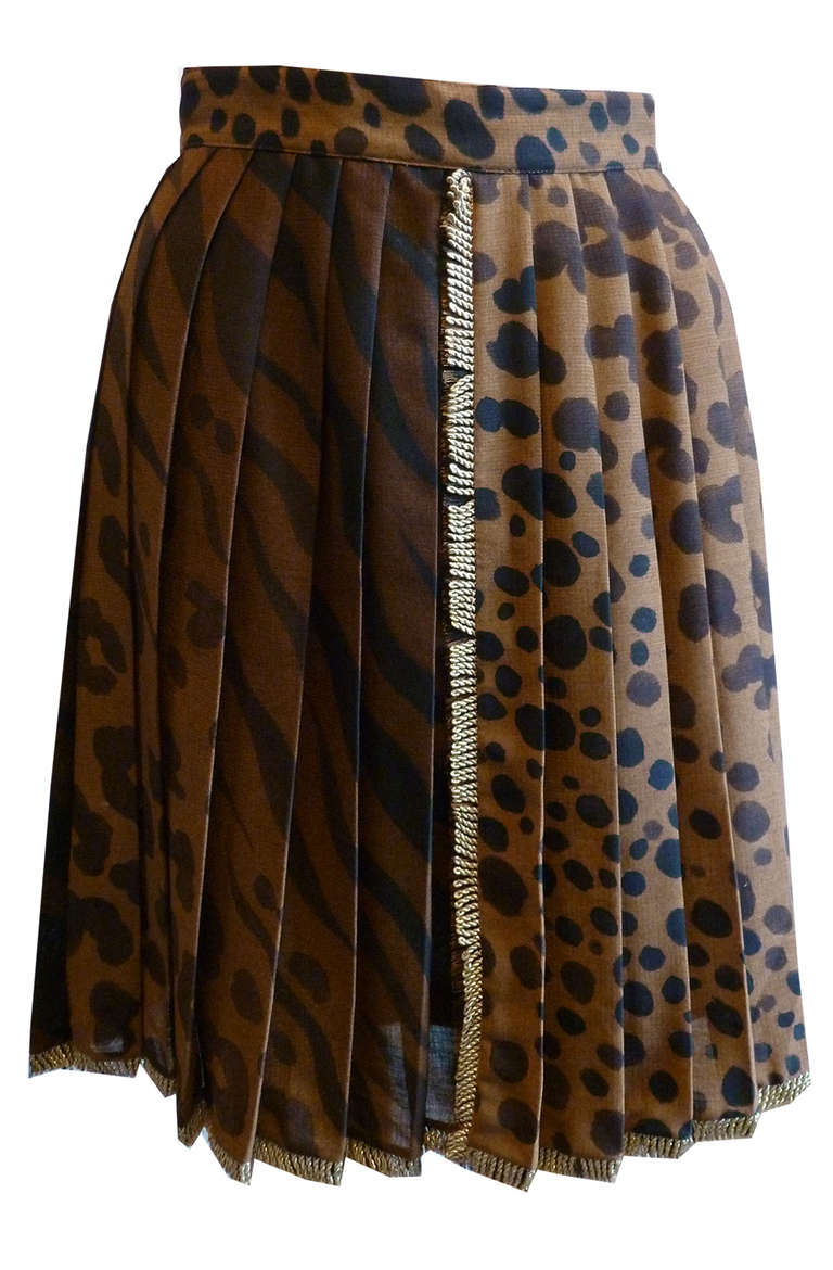 Gianni Versace Couture leopard print pleated skirt with gold braid edging from the Spring/Summer 1992 collection. The skirt was also part of the Christie's sale of the collection of the late Elizabeth Taylor in December 2011.

Marked an Italian