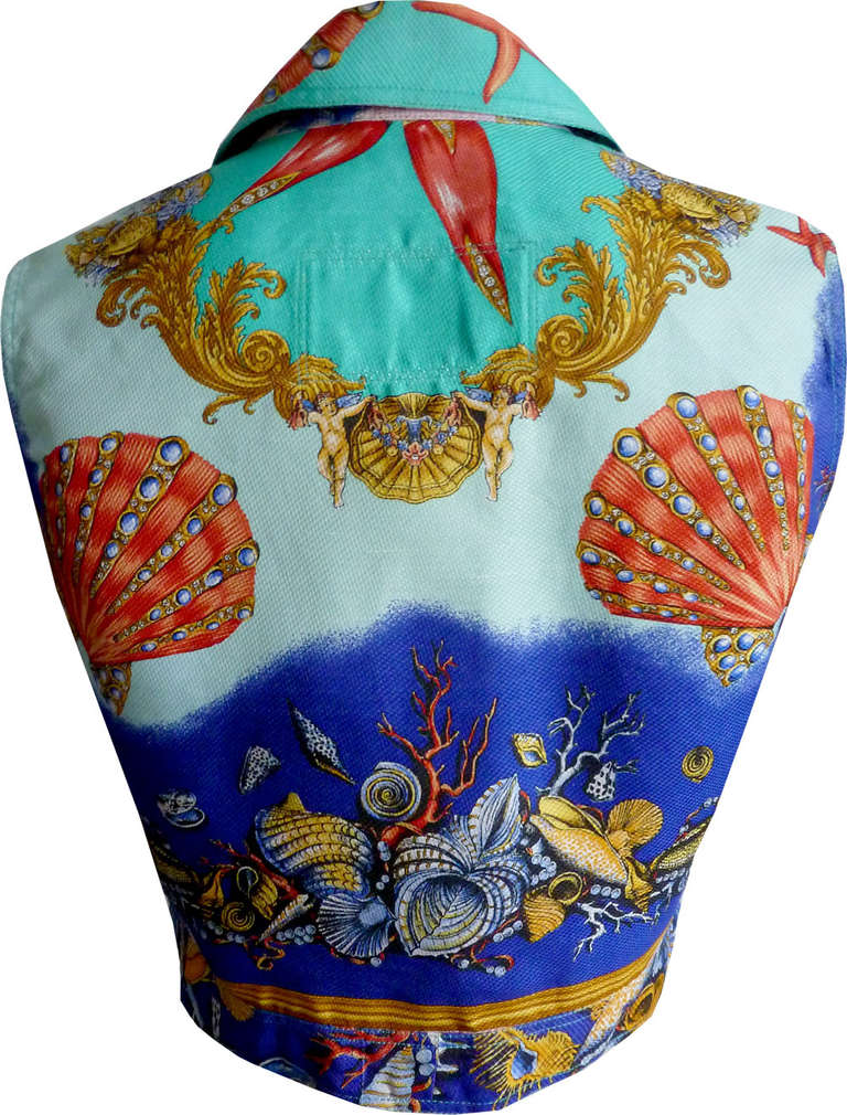 Gianni Versace Pret-A-Porter iconic seashell print waistcoat from the Spring/Summer 1992 collection. This rare waistcoat was featured on the front cover of the catalogue for the collection. The waistcoat features gilt embossed Medusa buttons both to