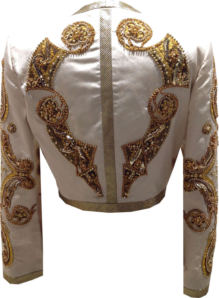 An important and iconic Gianni Versace Couture silk faille moire embroidered, appliquéd and beaded jacket from the Spring/Summer 1992 collection. The jacket is fully lined in brown, white and gold leopard-printed and baroque-pattern-printed 