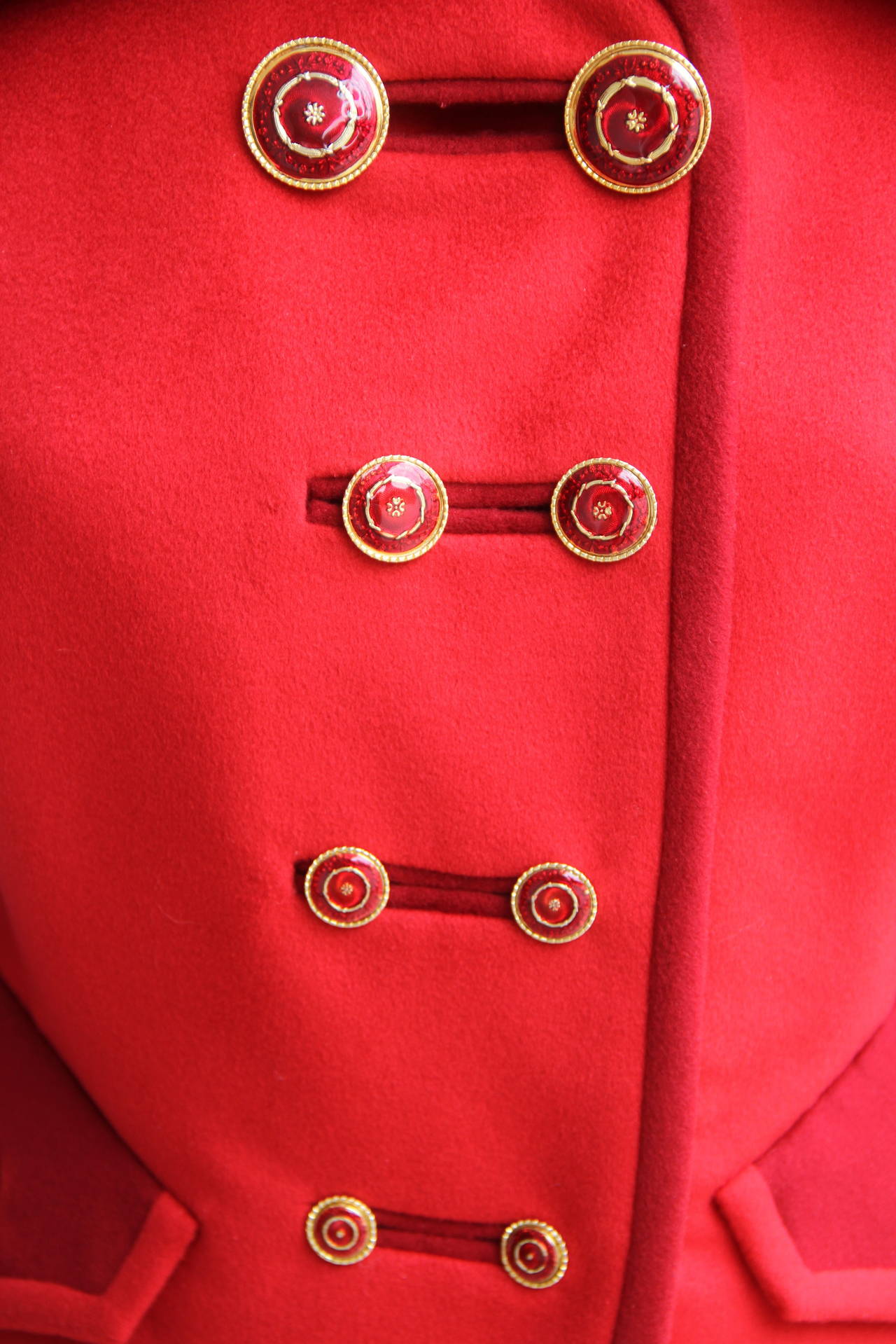A dramatic and rare Atelier Versace Nautical collection double-breasted scarlet wool jacket, with contrast red wool detailing, from the Spring 1993 Haute Couture collection, shown at The Ritz in Paris.

The jacket features two rows of gilt metal