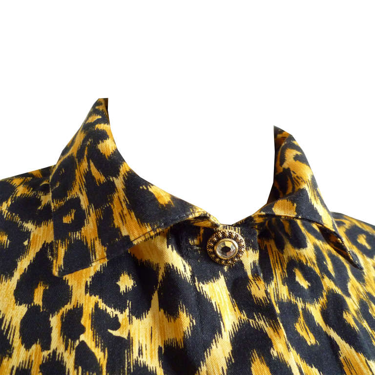 Gianni Versace leopard print cotton blouse from the Spring/Summer 1992 Versus collection. The blouse is secured at the neck by a single glass and metal button.  The cuffs are also secured by a single glass and metal button to each cuff.The blouse