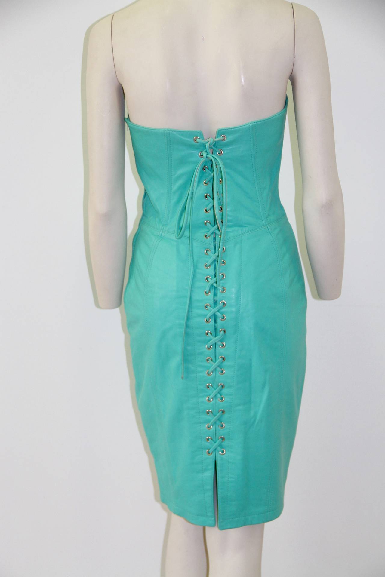 A rare 1980's Michael Hoban For North Beach Leather turquoise lace-up strapless dress.

Marked a Medium (US).