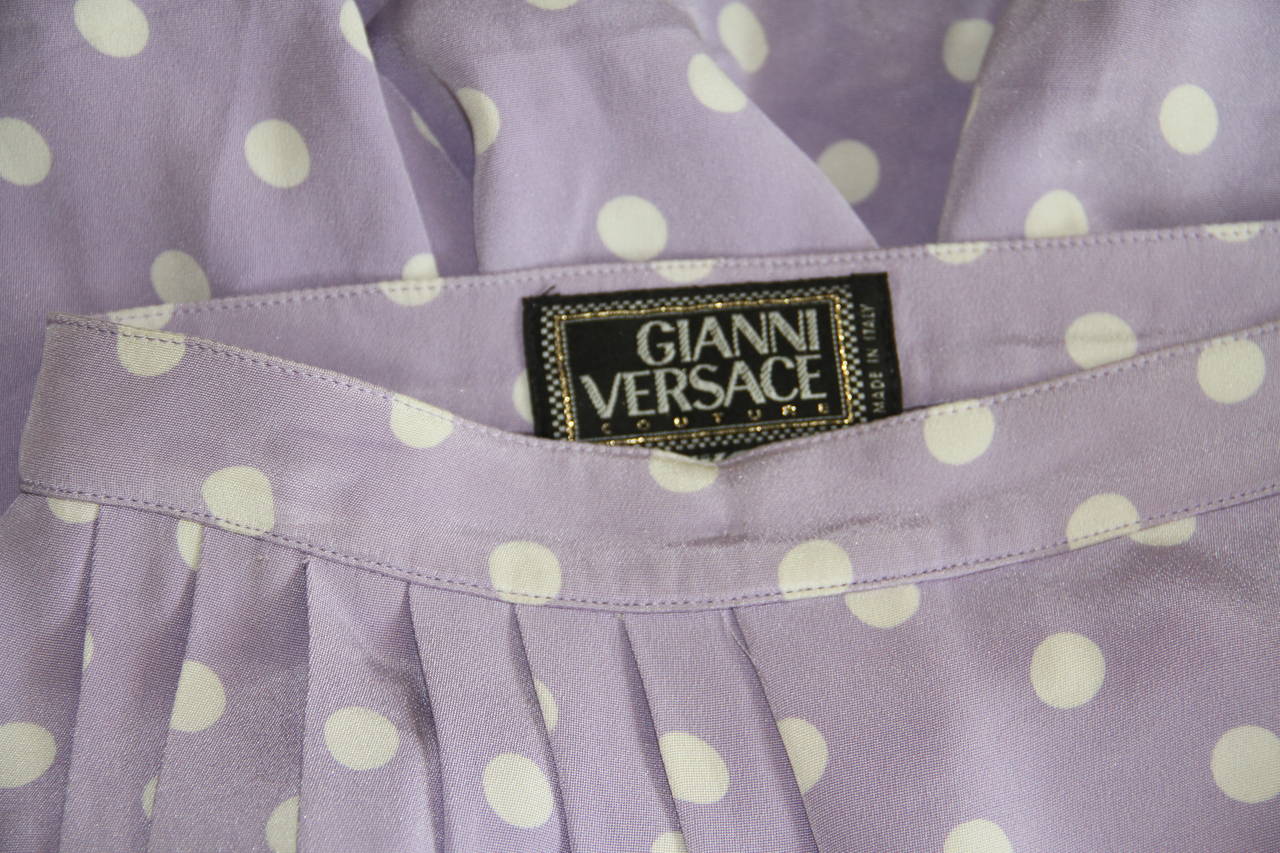 Gianni Versace lilac and white silk polka dot pleated skirt from the Spring 1994 Punk collection. The skirt featured in the advertising campaign for the collection.

Marked an Italian size 40.

Manufacturer - Alias S.p.a.

Fabric content -