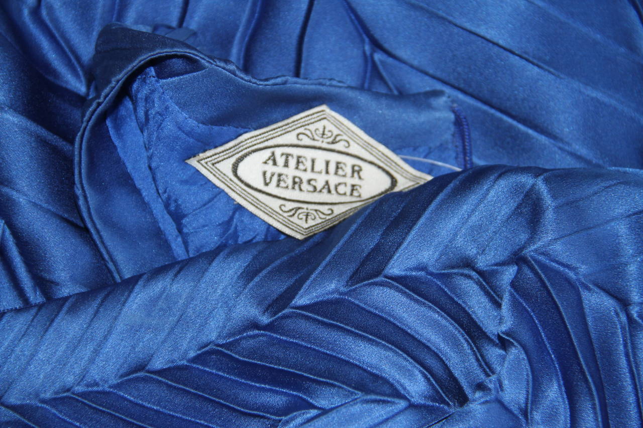 Very rare Atelier Versace electric blue pleated and creased silk babydoll cocktail dress from the Spring 1994 Haute Couture Punk collection, shown at The Ritz in Paris.

The dress features weights in the hem, to enhance the movement of the piece