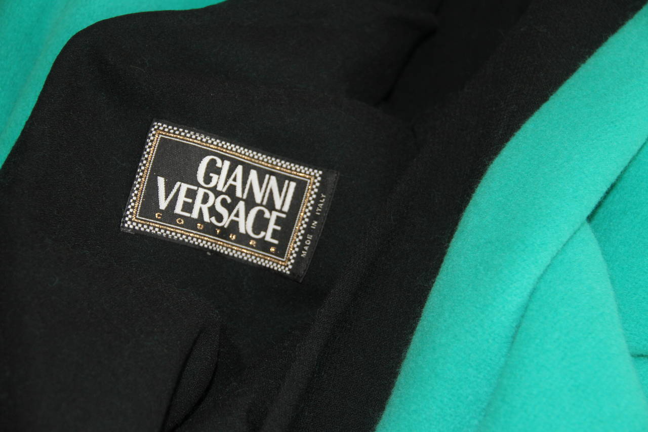 Rare Gianni Versace colour-blocked coat from the Fall 1991 collection.

Marked an Italian size 38.

Manufacturer - Alias S.p.a.

Fabric content - 64% wool / 3% nylon / 22% angora / 11% cashmere