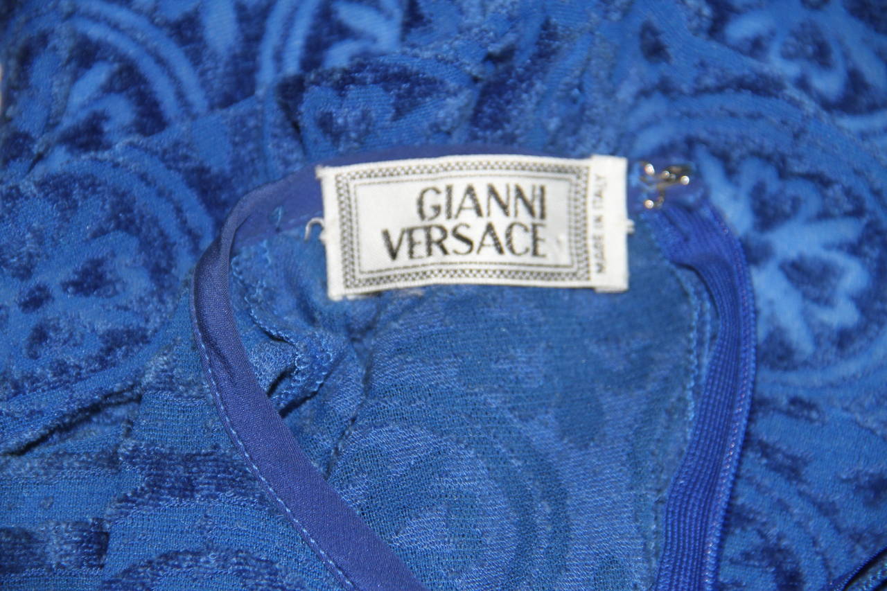 Gianni Versace blue laser-cut velour bodysuit from the Spring 1994 Punk collection.

Unmarked, however, sizing is equivalent an Italian size 40.

Manufacturer - Alias S.p.a.