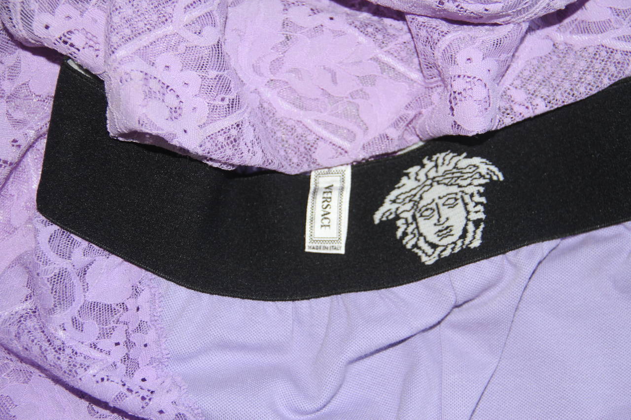 Gianni Versace lilac lace stretch leggings, with Medusa waistband from the Spring 1994 Punk collection.

Marked an Italian 42.

Manufacturer - Alias S.p.a.

Fabric content - 66% nylon / 23% cotton / 11% spandex