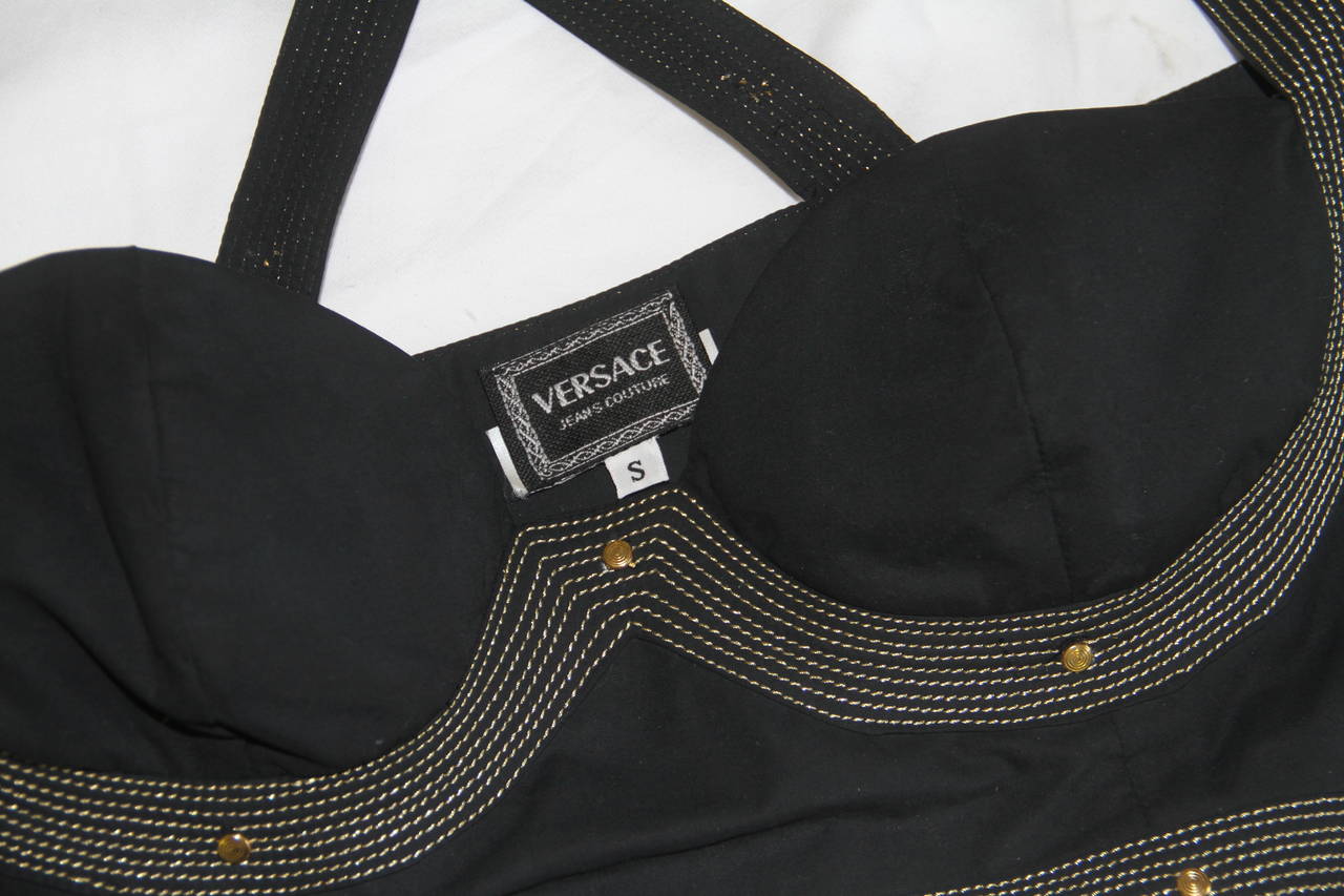 Gianni Versace black cotton bustier from the Fall 1992 Versace Jeans Couture Bondage collection.

Marked a small.

Manufacturer - Ittierre S.p.a.

Fabric content - 100% cotton