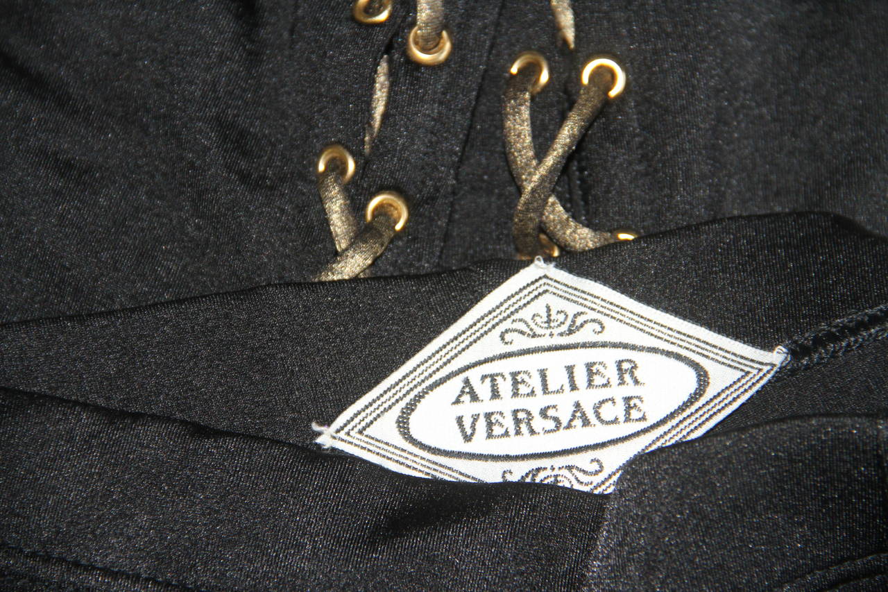 Very rare Atelier Versace bondage lace-up leggings from the Fall 1994 Haute Couture collection, shown at The Ritz in Paris.

Unmarked, however, sizing is equivalent to an Italian size 40.

Manufacturer - Alias S.p.a.

Fabric content - 80%