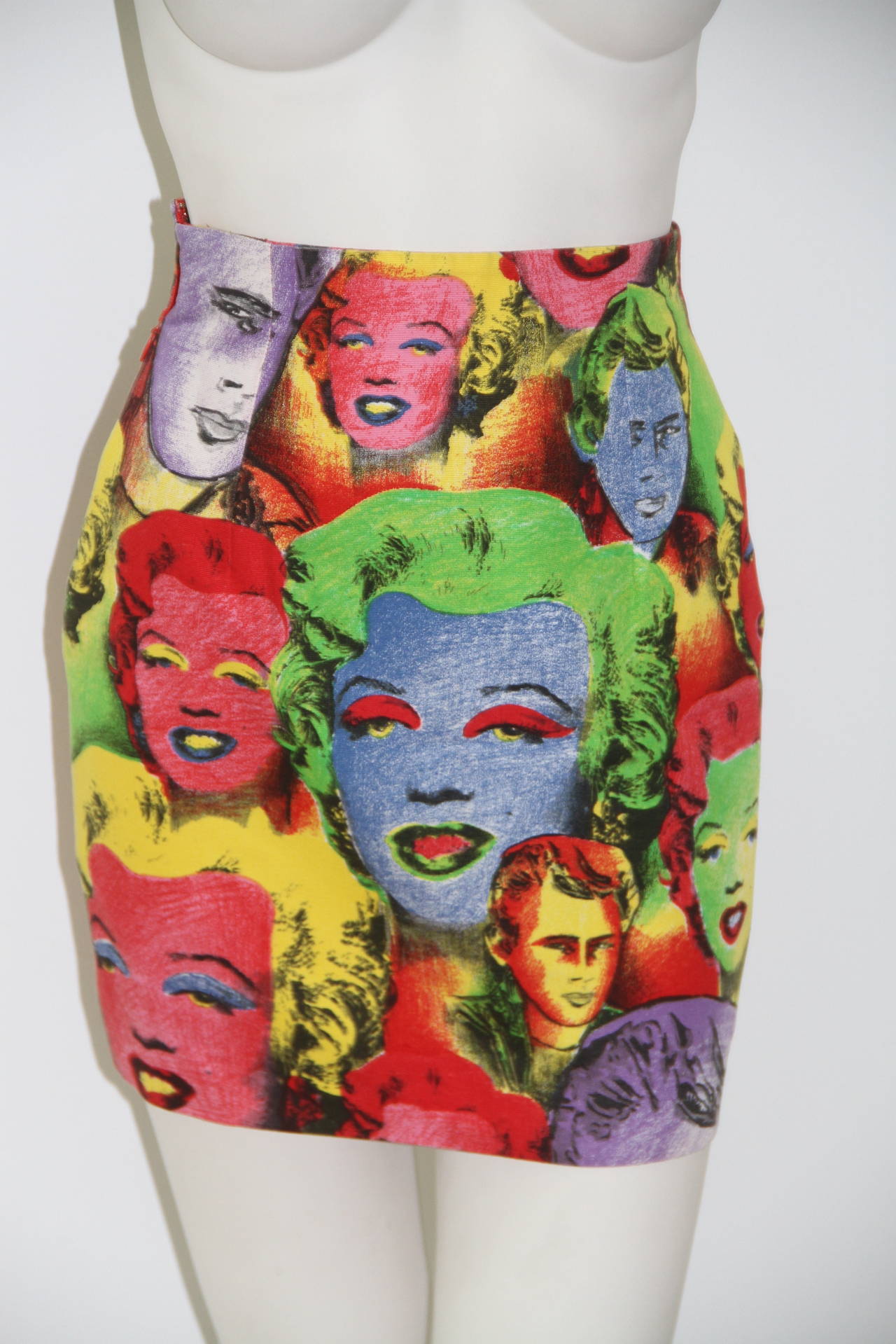 Iconic Gianni Versace silk jersey top and skirt ensemble, featuring polychrome images of Marilyn Monroe and James Dean from the Spring 1991 Pop Art collection.

Marked an Italian size 38.

Manufacturer - Alias S.p.a.
