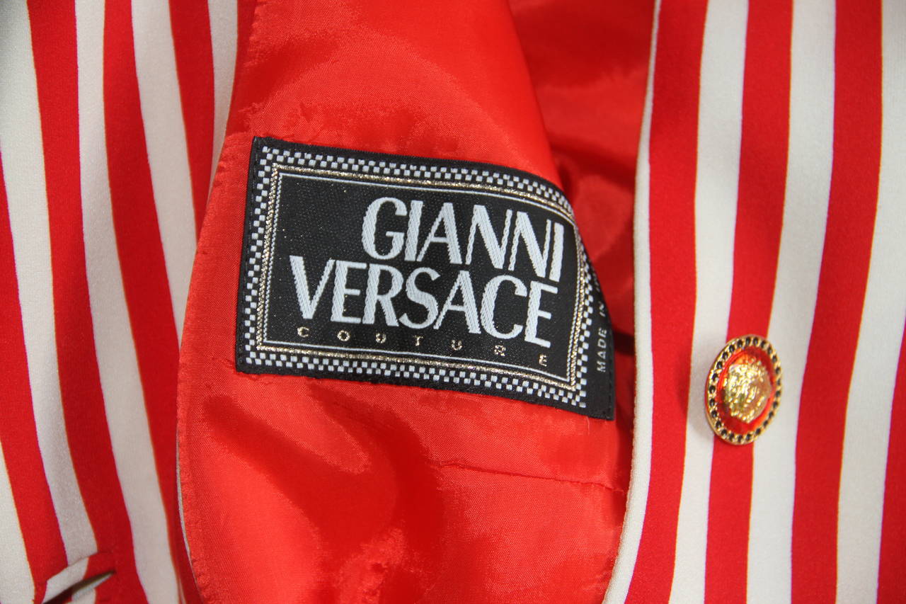 Gianni Versace silk striped jacket from the Spring 1993 collection. The jacket featured in the Richard Avedon campaign for the collection.

The jacket is secured on the front and at the cuffs by a series of gold-tone metal, paste and enamel Medusa