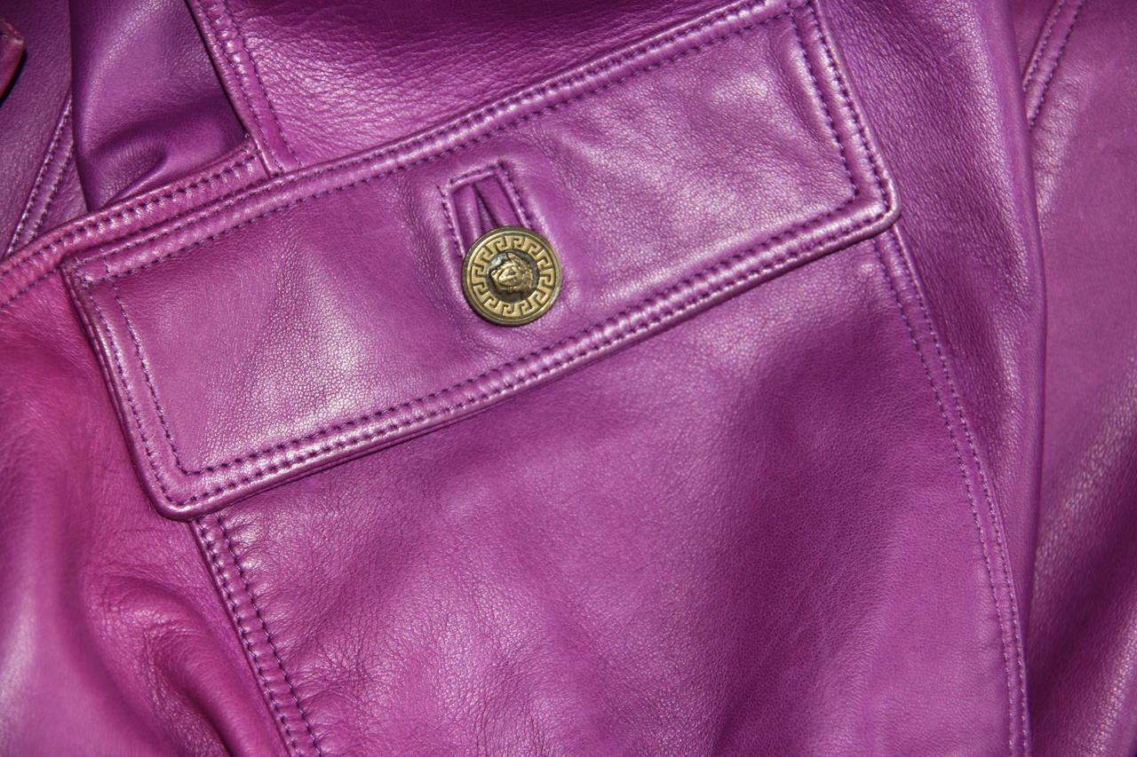 Gianni Versace purple leather pinafore dress from the Fall 1995 collection.

Unmarked, however, sizing is equivalent to an Italian size 40/42.

Manufacturer - Ruffo S.p.a.
