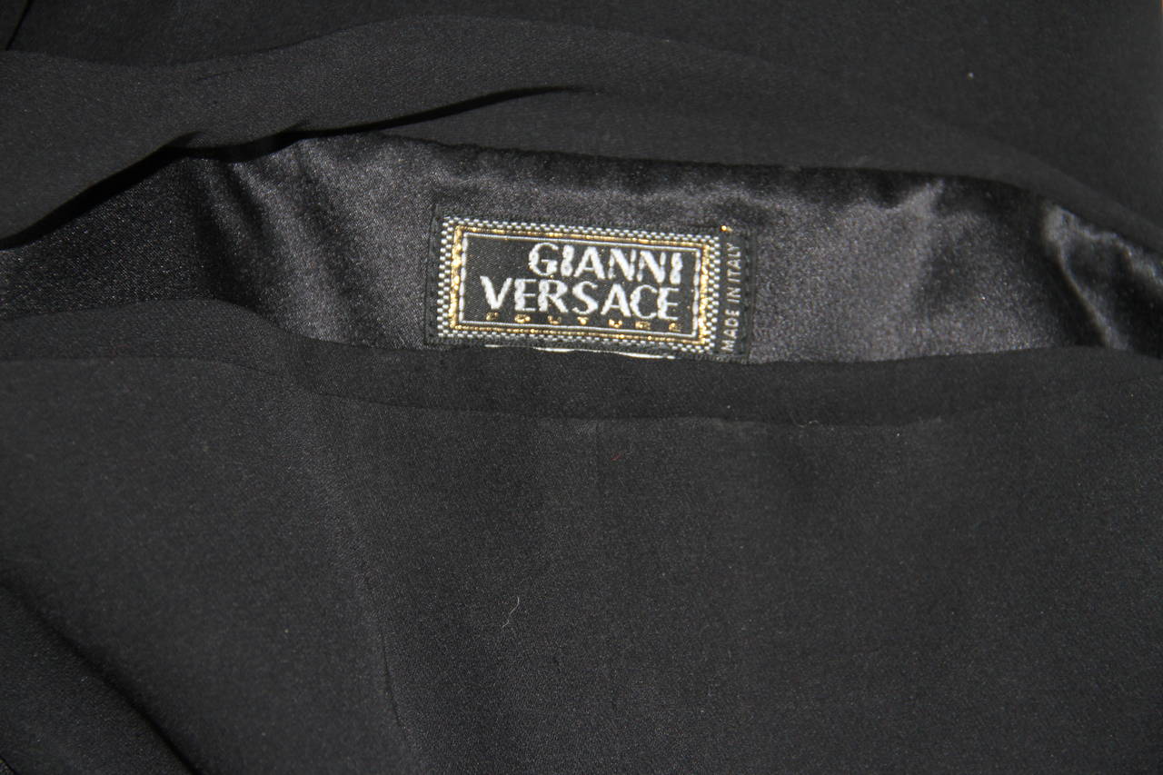 Gianni Versace black silk jersey draped one-shoulder jumpsuit from the Fall 1998 collection.

Unmarked, however, sizing is equivalent to an Italian size 40.

Manufacturer - Alias S.p.a.