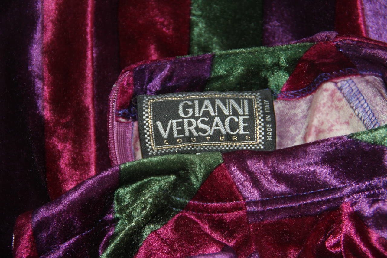 Iconic Gianni Versace multi-coloured striped velvet stretch evening gown from the Fall 1993 collection.

Unmarked, however, sizing is equivalent to an Italian size 40.

Manufacturer - Alias S.p.a.

Fabric content - 74% acetate / 18% nylon / 8%