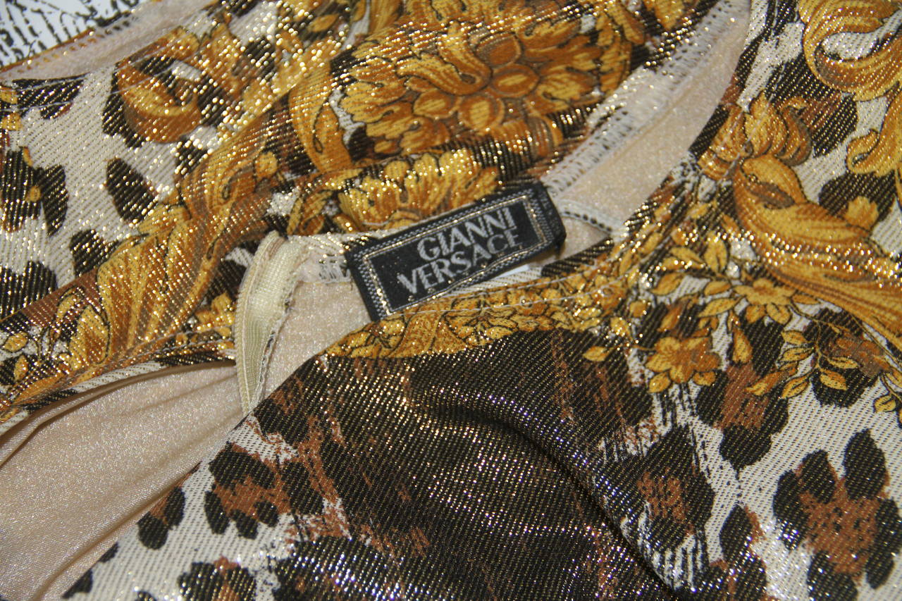 Iconic Gianni Versace wild Baroque printed metallic evening ensemble from the Spring 1992 collection. The ensemble featured in the advertising campaign for the collection.

Marked an Italian size 40.

Manufacturer - Alias S.p.a.

Fabric