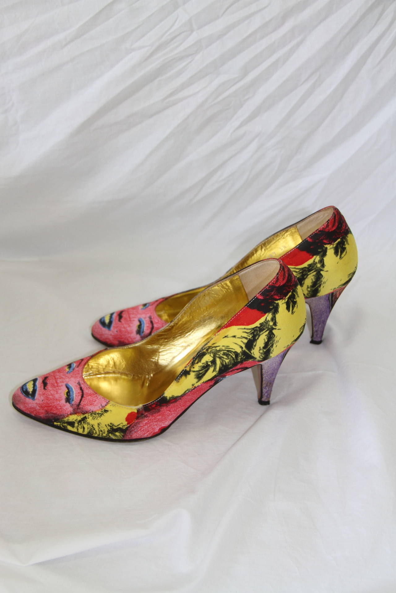 Iconic Gianni Versace silk and leather shoes, featuring polychrome images of Marilyn Monroe and James Dean, from the Spring 1991 Pop Art collection.

Marked an Italian size 38.

Manufacturer - Sergio Rossi S.p.a.