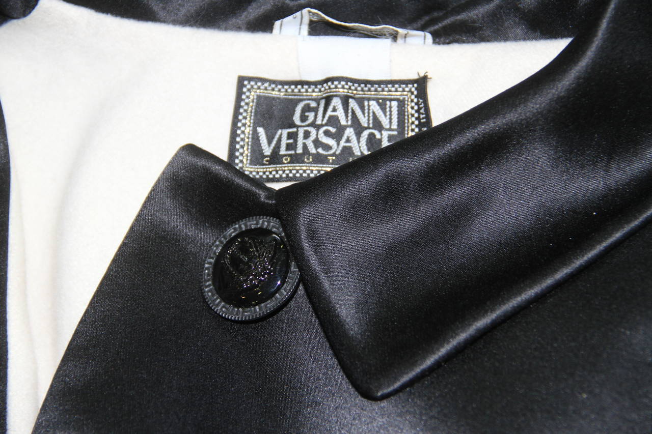 Gianni Versace black silk four button jacket from the Fall 1995 collection.

Marked an Italian size 42.

Manufacturer - Alias S.p.a.

Fabric content - 100% silk