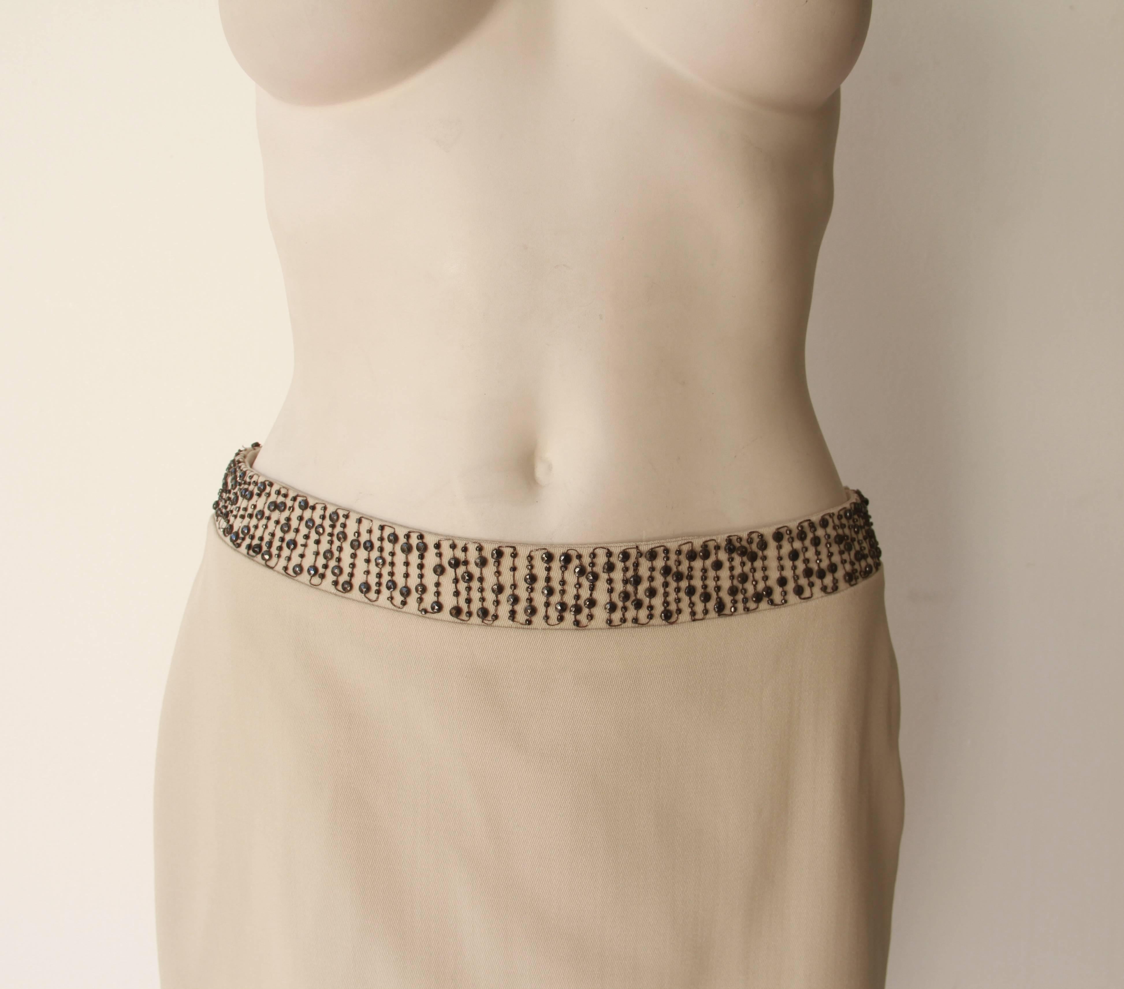 Gianni Versace micro mini skirt, featuring a beaded waistband from the Spring 1998 collection.

Marked an Italian size 42. However, please note that the skirt runs small and the fit is closer to an Italian size 40.

Manufacturer - Alias