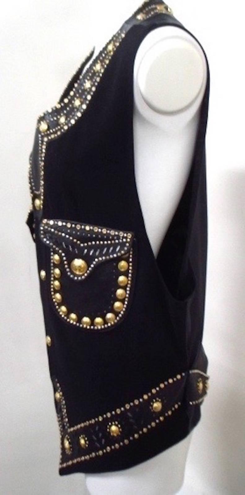 Iconic museum quality Gianni Versace men's bondage Medusa studded leather and wool vest from the Spring 1993 Miami collection.

Marked an Italian size 50.

Manufacturer - Alias S.p.a.

Please contact out stylists for additional information.