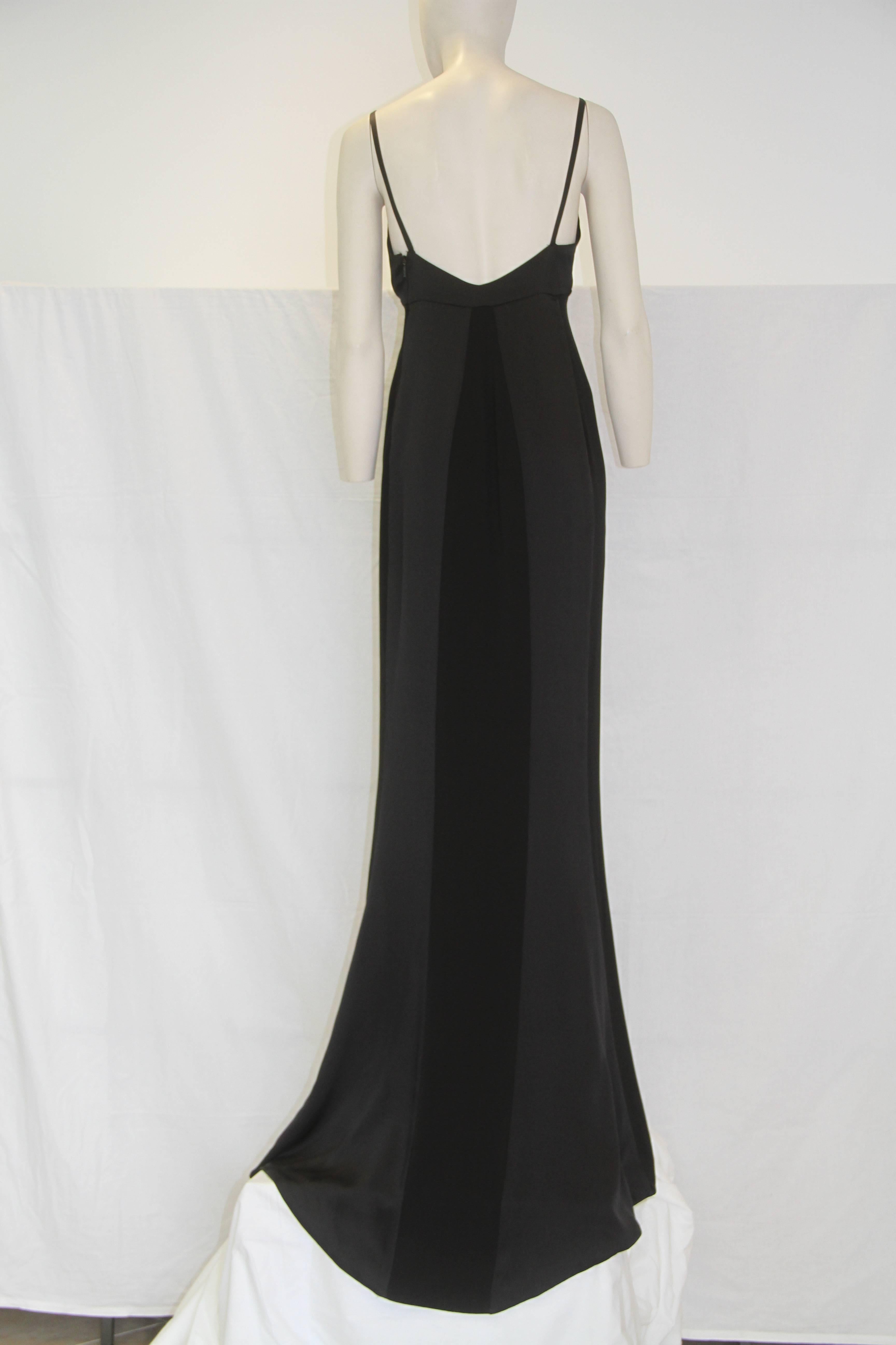 Tom Ford For Gucci black silk evening gown from 2001. Simply stunning and timeless, the gown features a silk satin bust and silk satin panel detailing to the back.

Marked an Italian size 42. However, the gown runs small and the fit is closer to