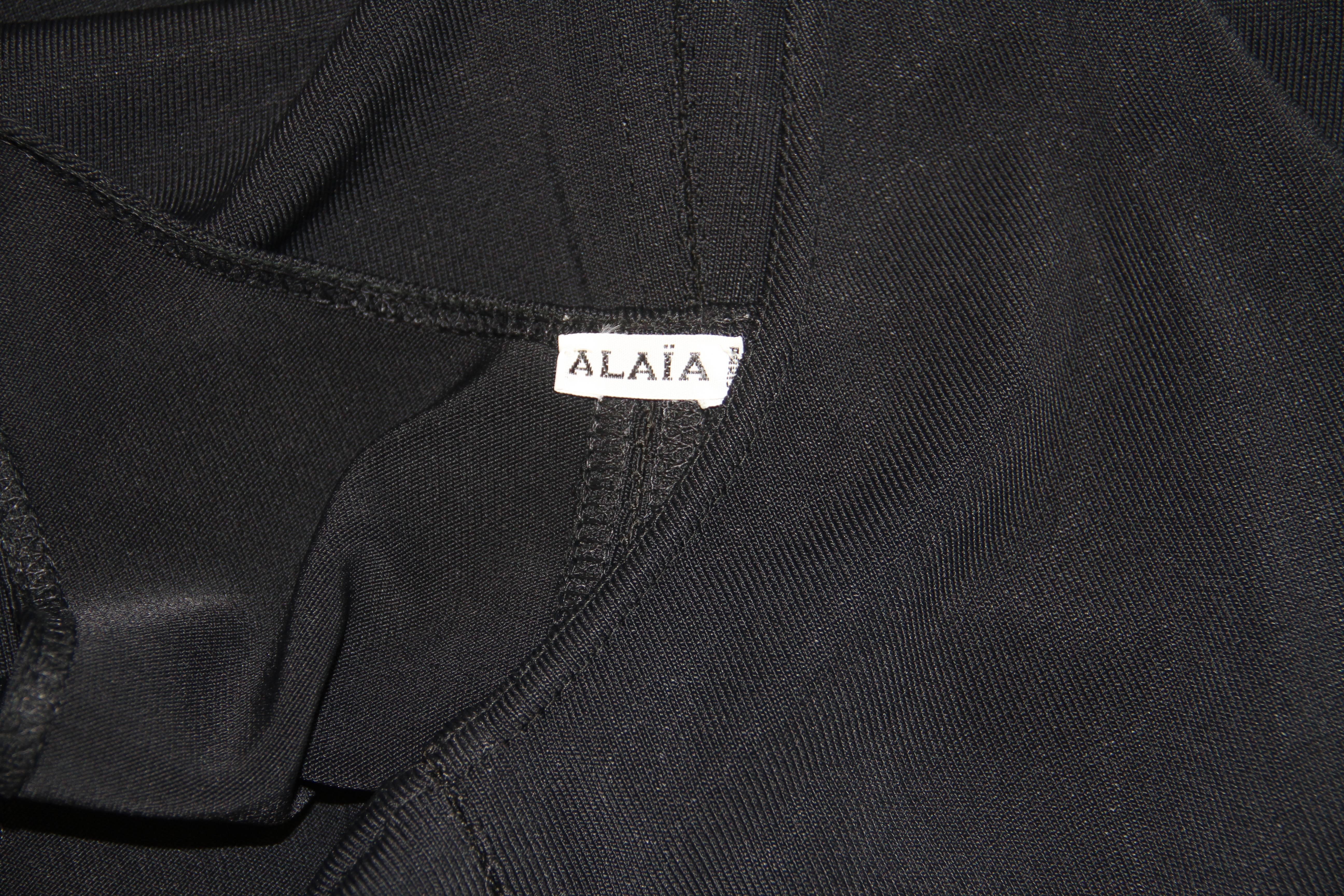 An early Azzedine Alaia black dress from the 1980's.

Marked a size S.

Fabric content - 92% polyester / 8% elastane