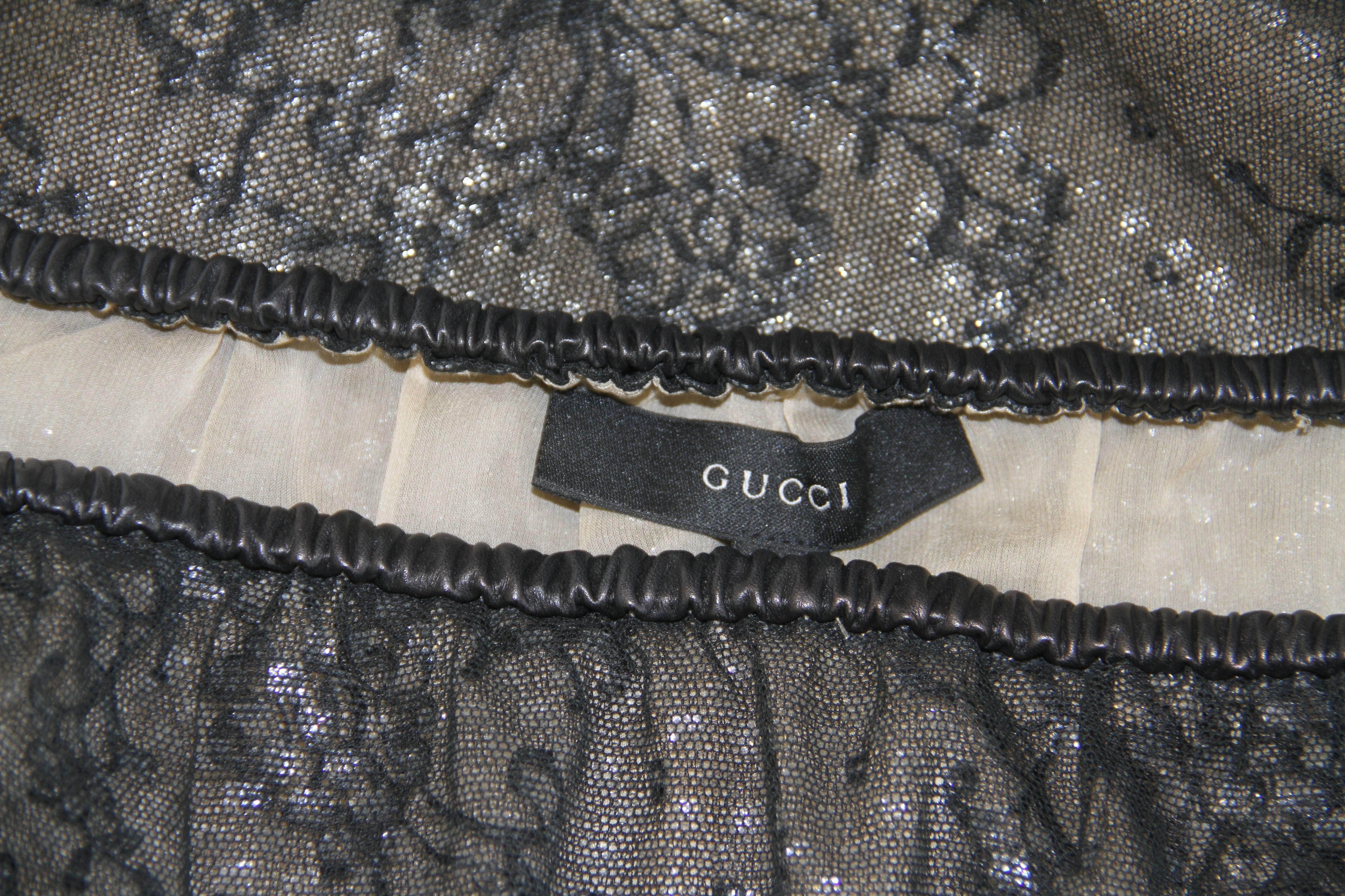 Tom Ford for Gucci lace skirt from the Fall 1999 collection. The skirt features a narrow black leather waistband.

Marked an Italian size 38.

Manufacturer - Zamasport S.p.a.

Fabric content - 37% cotton / 33% nylon / 30% silk